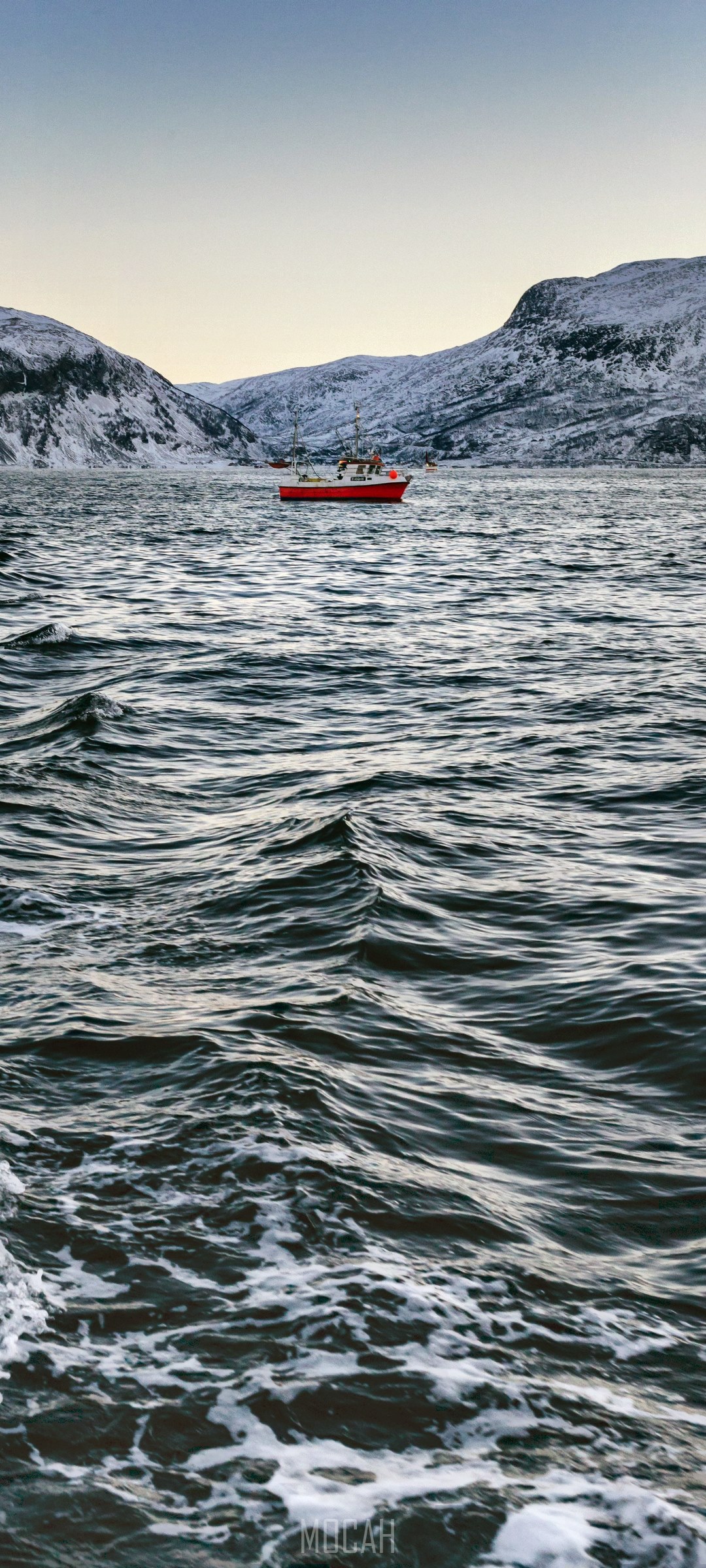 Red boat on a choppy sea with snow-capped mountains HD Phone Wallpaper