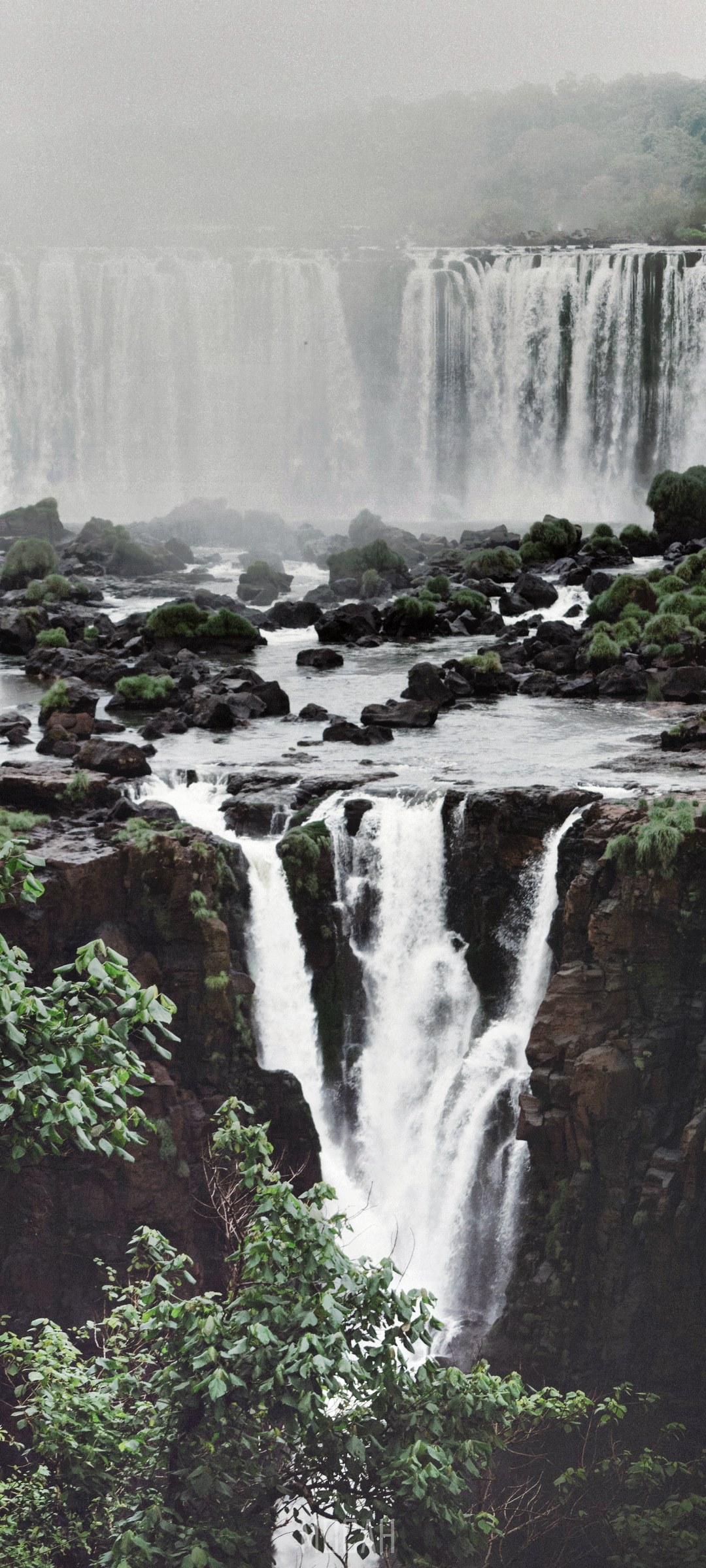 Waterfalls cascading over rocks and trees HD Phone Wallpaper