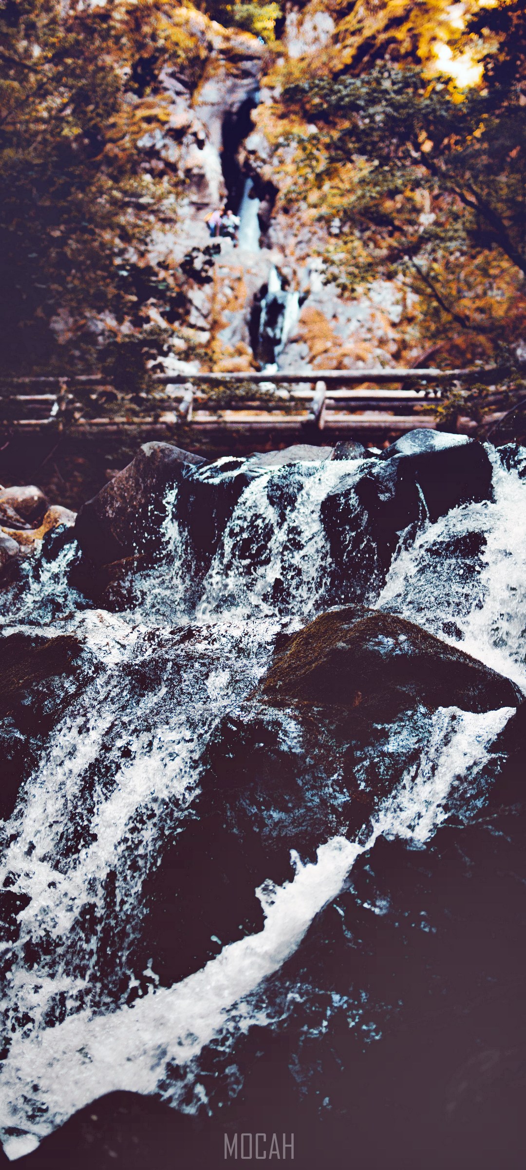 Waterfall cascading over rocks with trees HD Phone Wallpaper