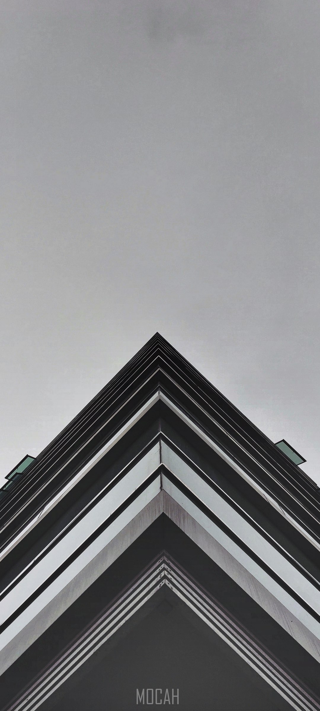Building corner against a cloudy sky HD Phone Wallpaper