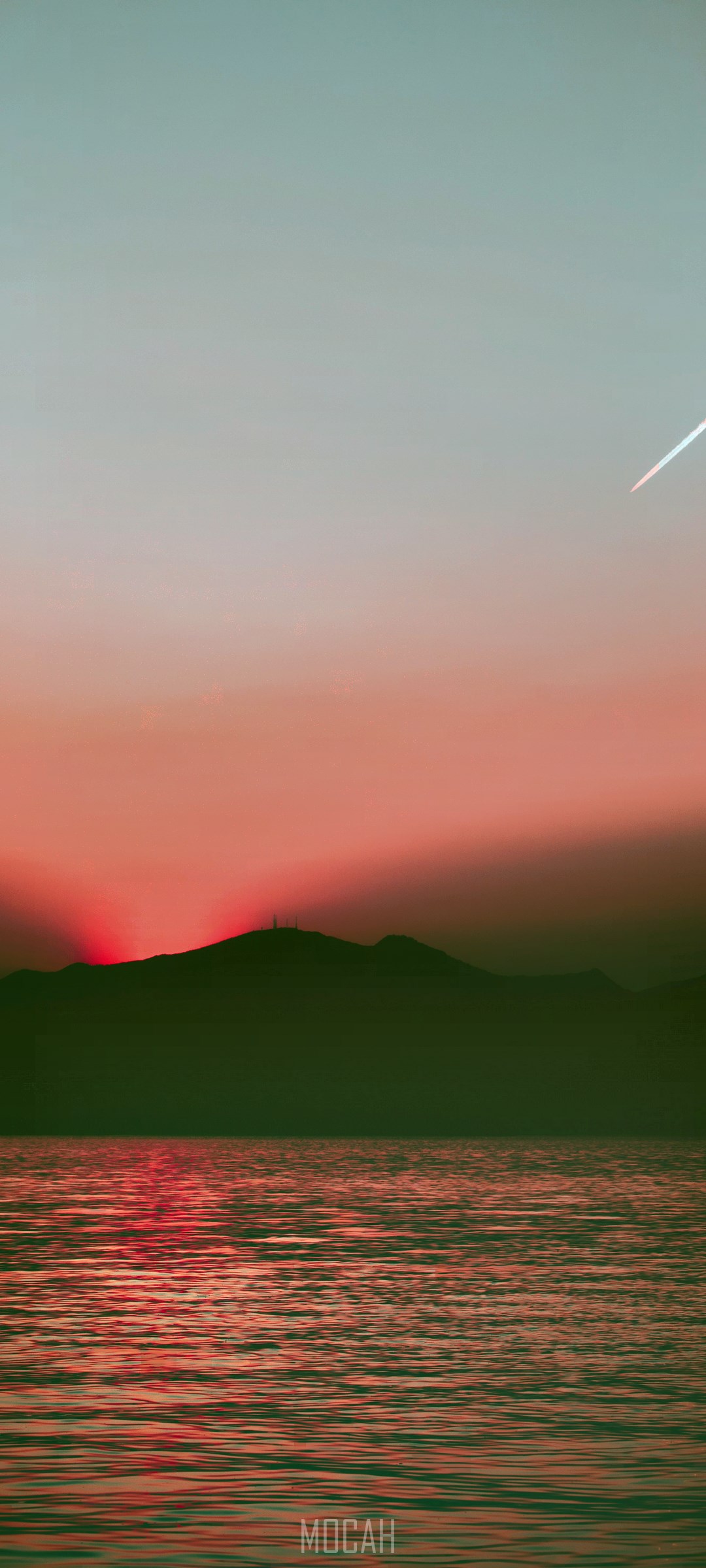 Sunset over the sea with mountain silhouette HD Phone Wallpaper