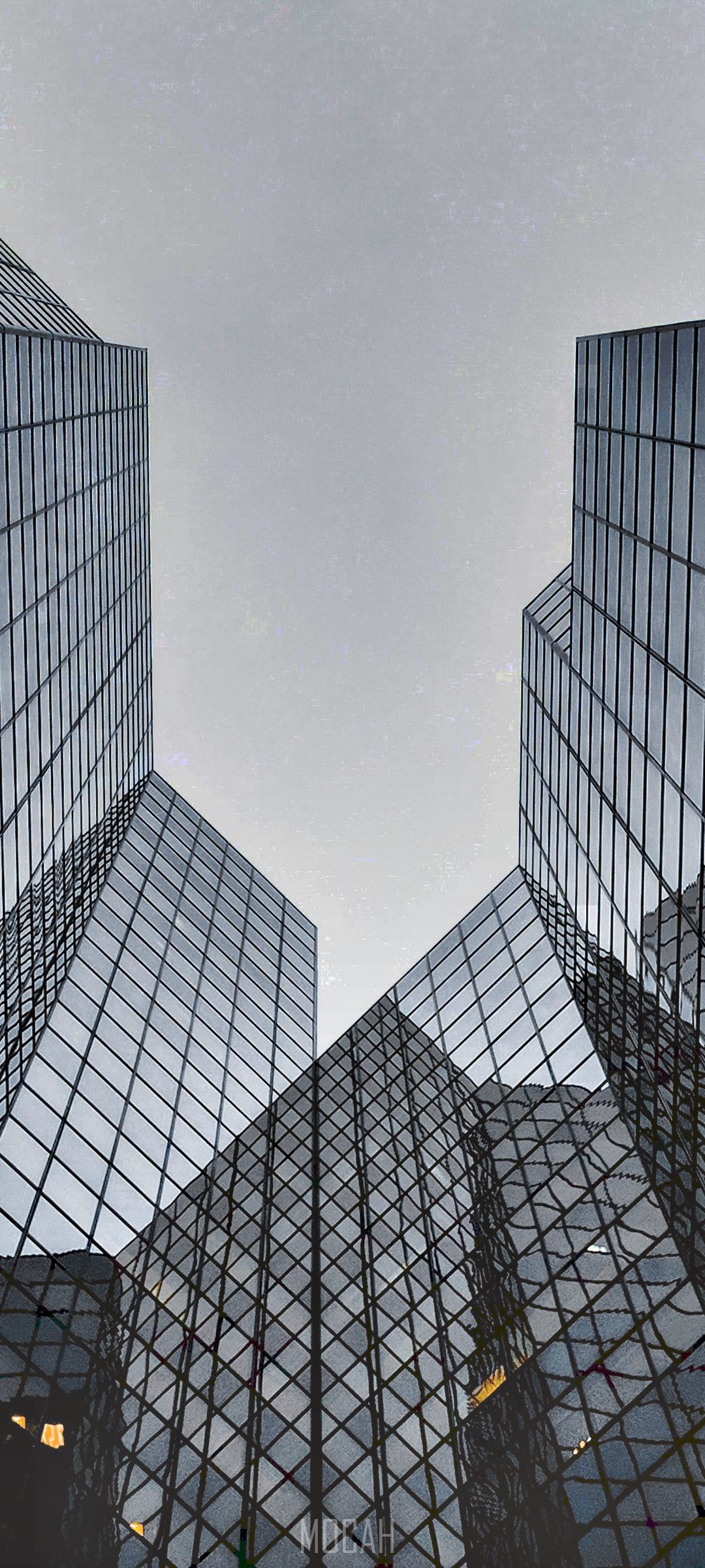 Modern glass skyscrapers against a cloudy sky HD Phone Wallpaper