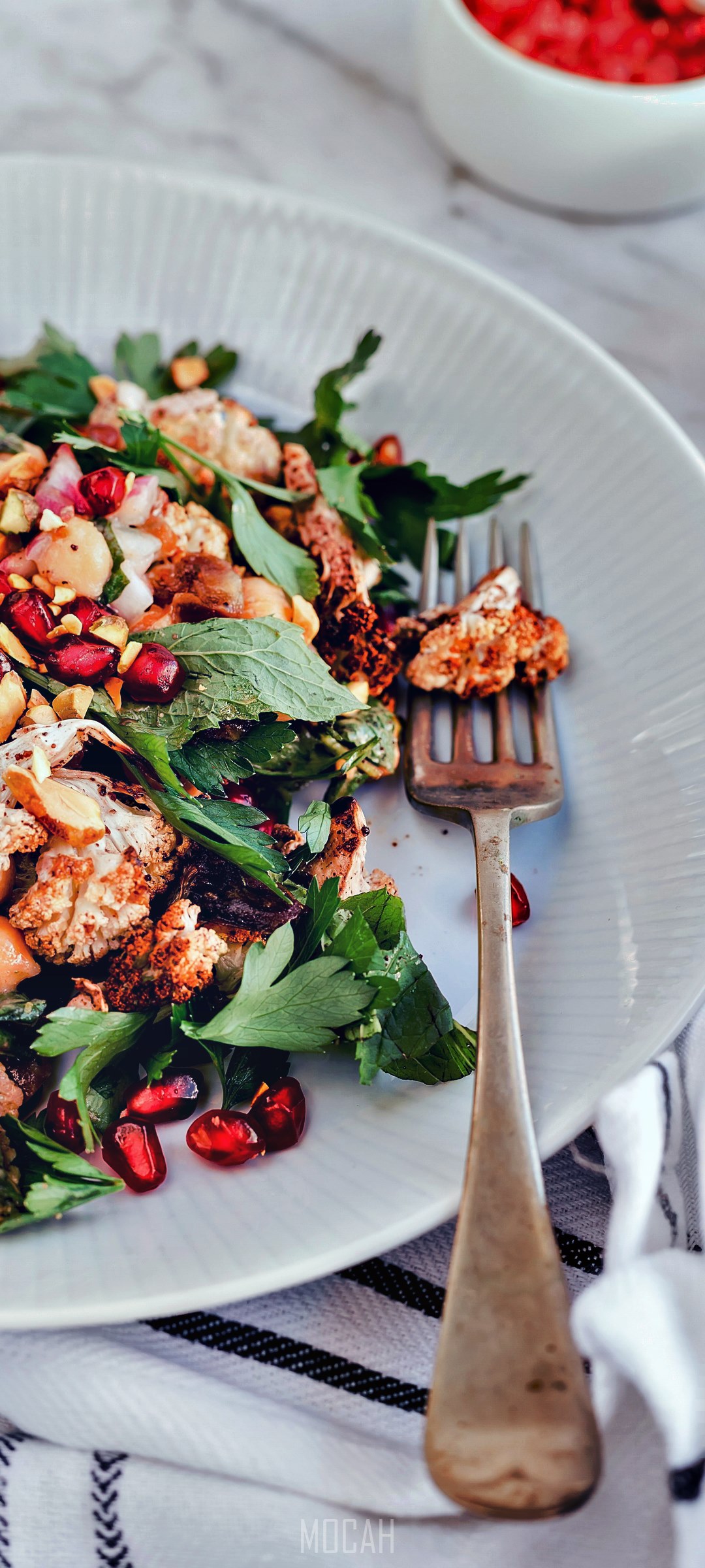 Roasted cauliflower salad with pomegranate and nuts HD Phone Wallpaper