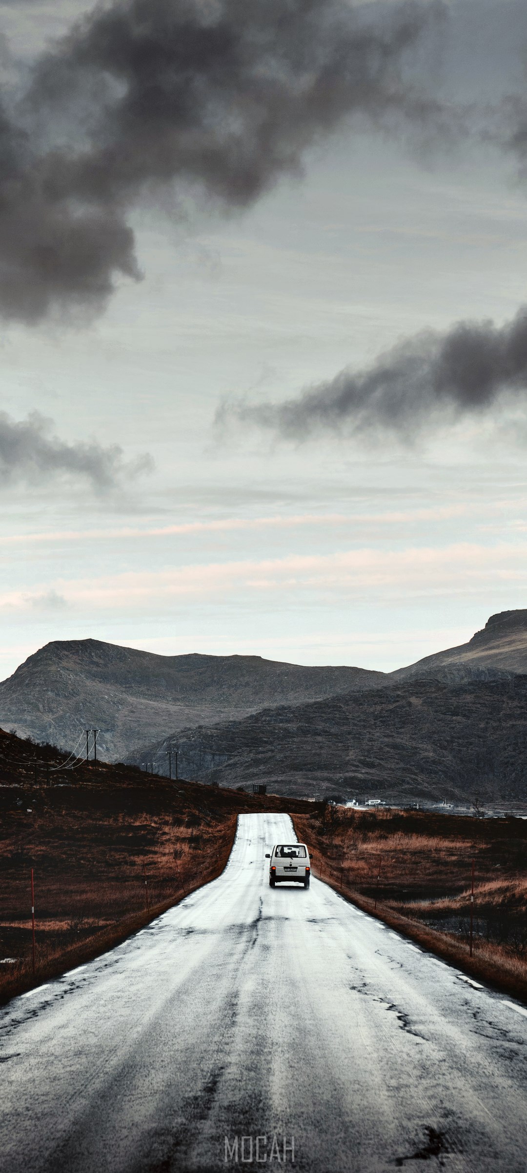 White car on a wet road in a mountainous landscape HD Phone Wallpaper