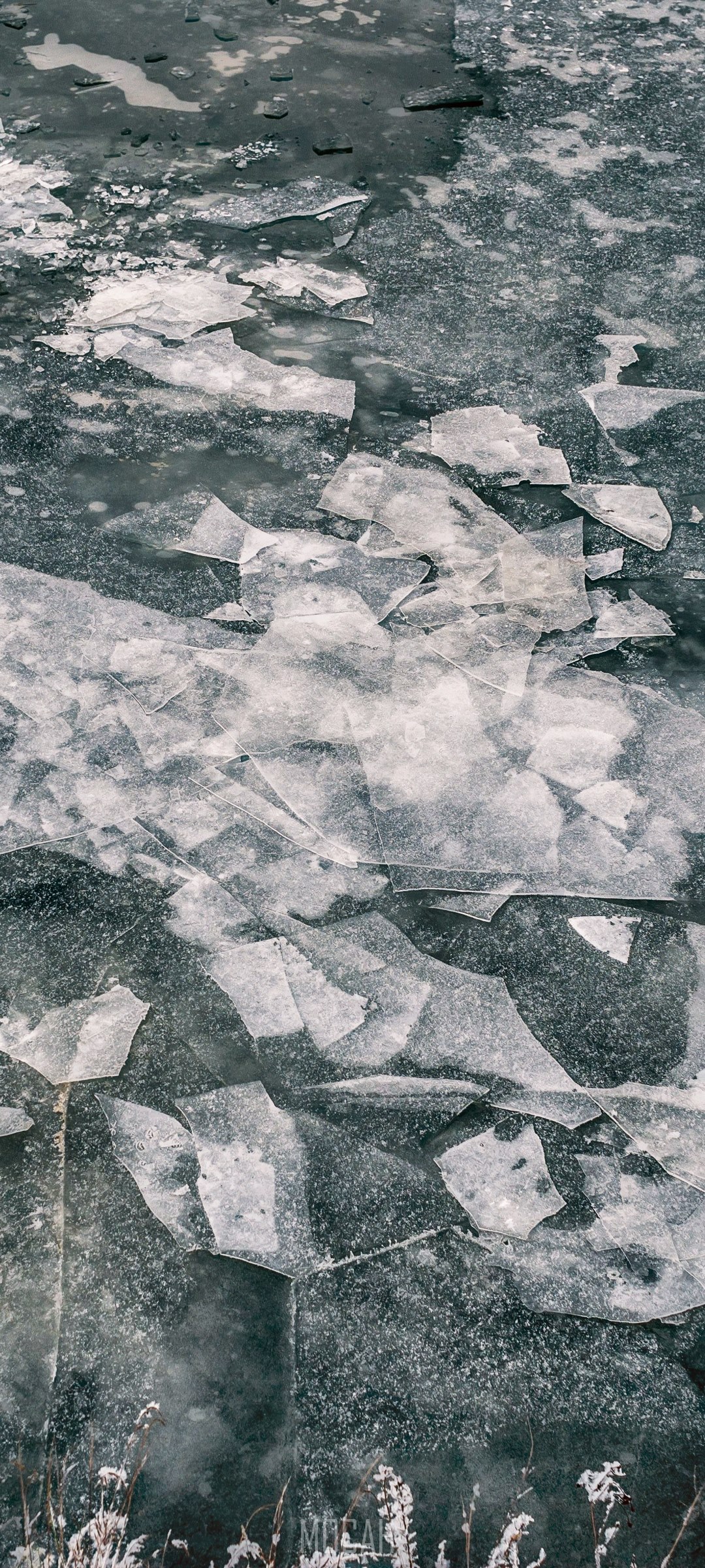 Broken ice on a frozen river HD Phone Wallpaper