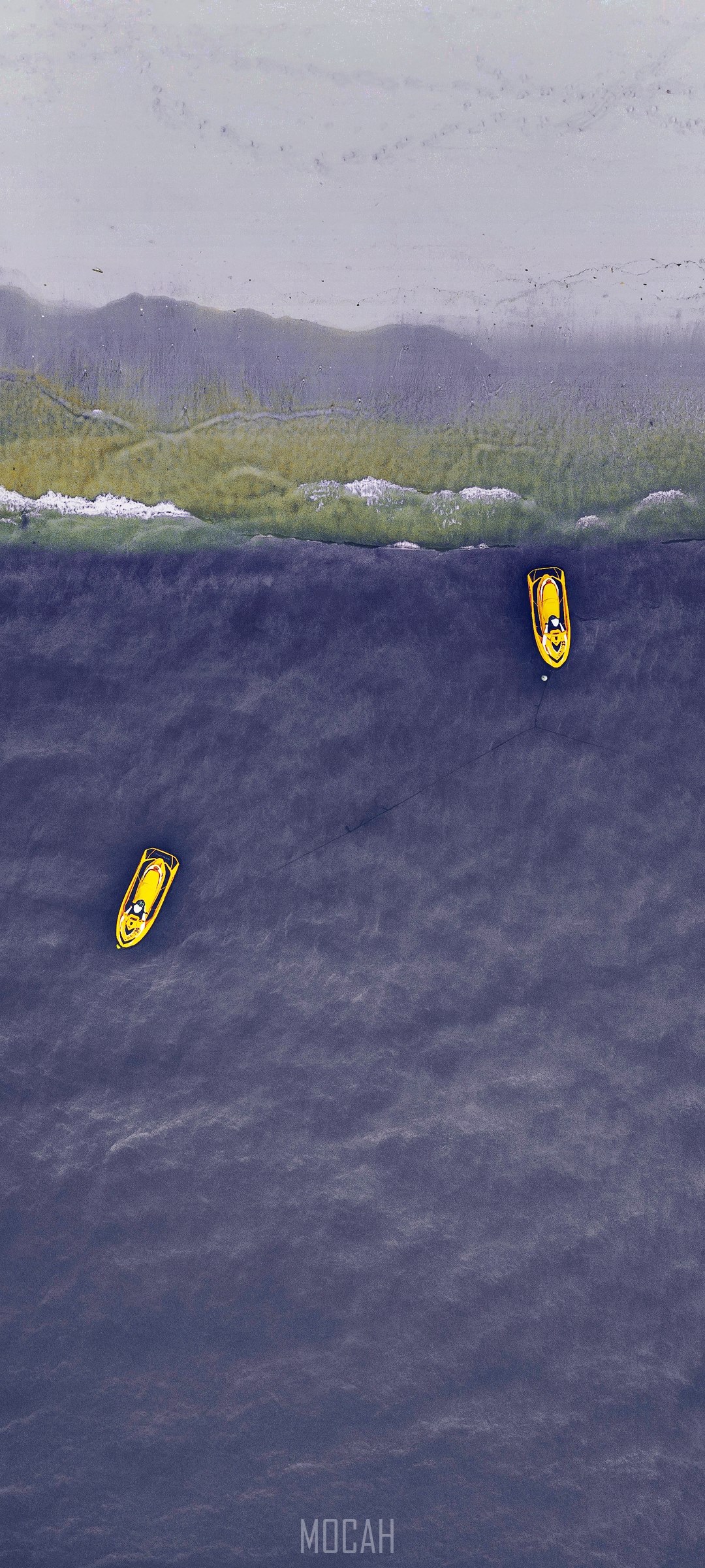 Two yellow jet skis on the water near a beach HD Phone Wallpaper