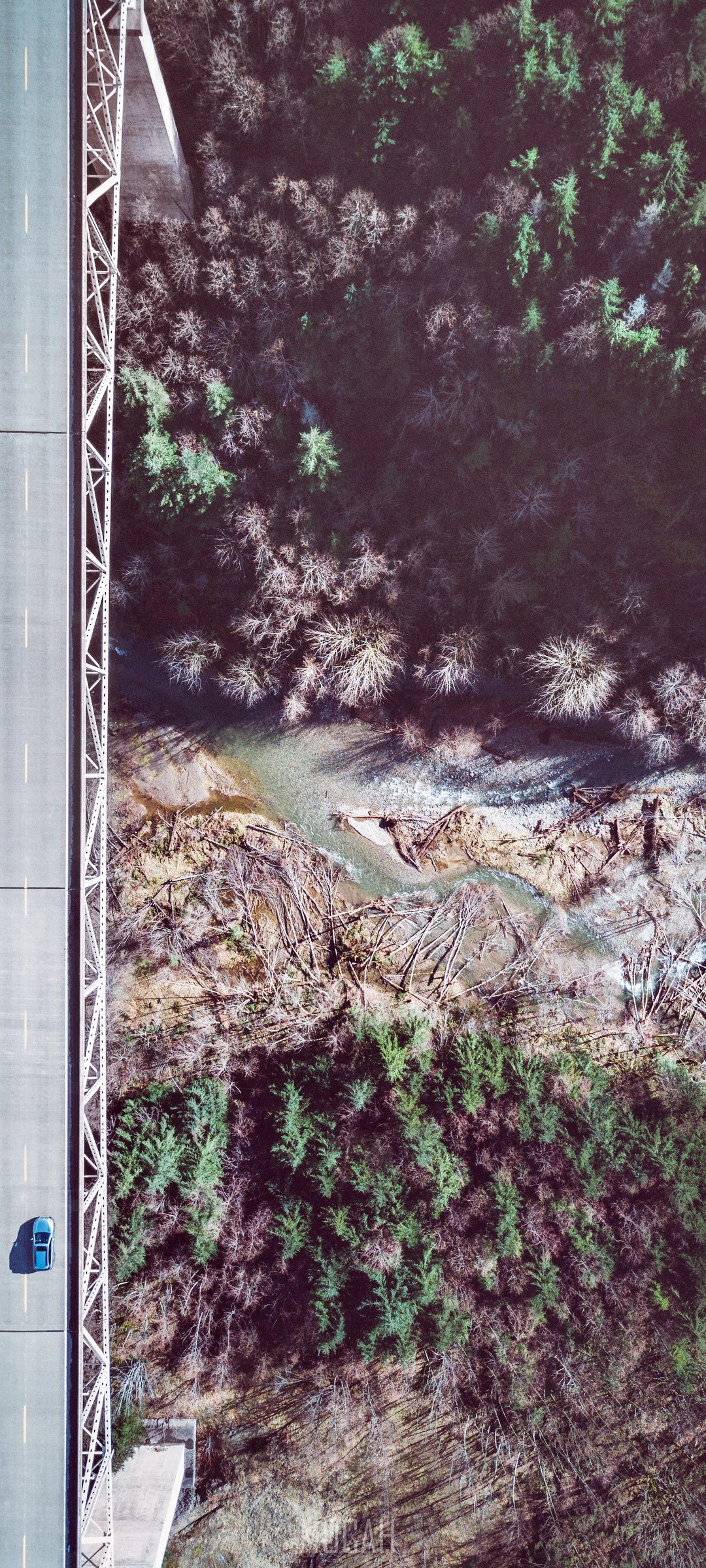 Drone shot of a car on a bridge over a ravine HD Phone Wallpaper