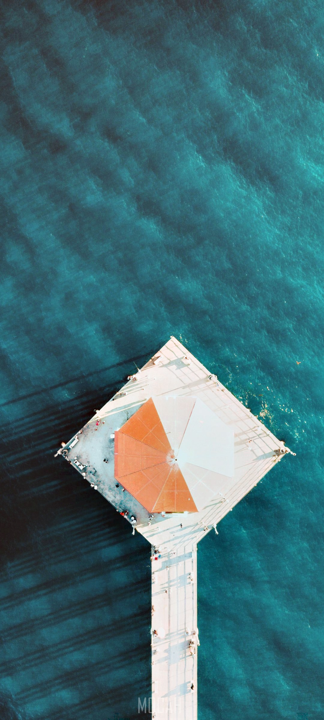 Aerial view of Huntington Beach pier with umbrella HD Phone Wallpaper