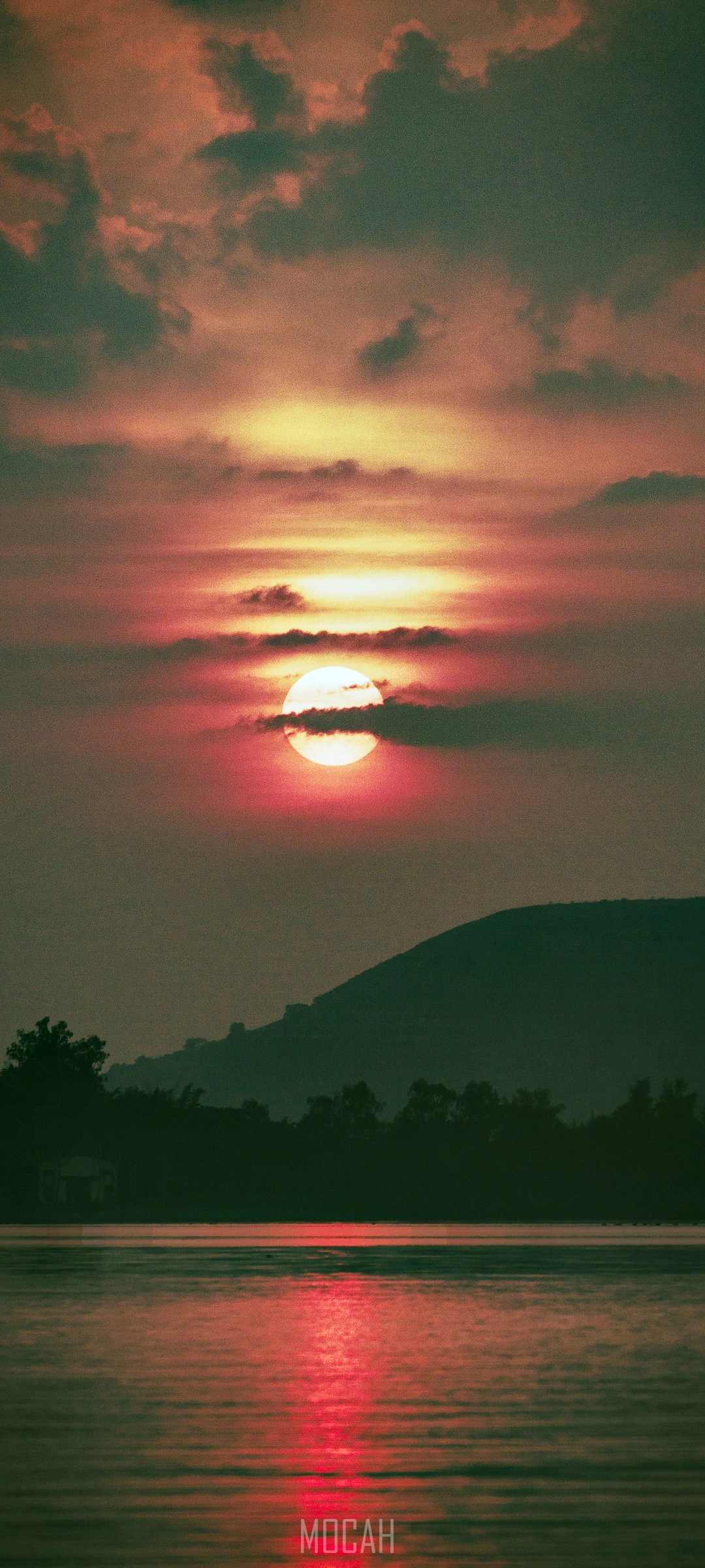 Sunset over a lake with a mountain silhouette HD Phone Wallpaper
