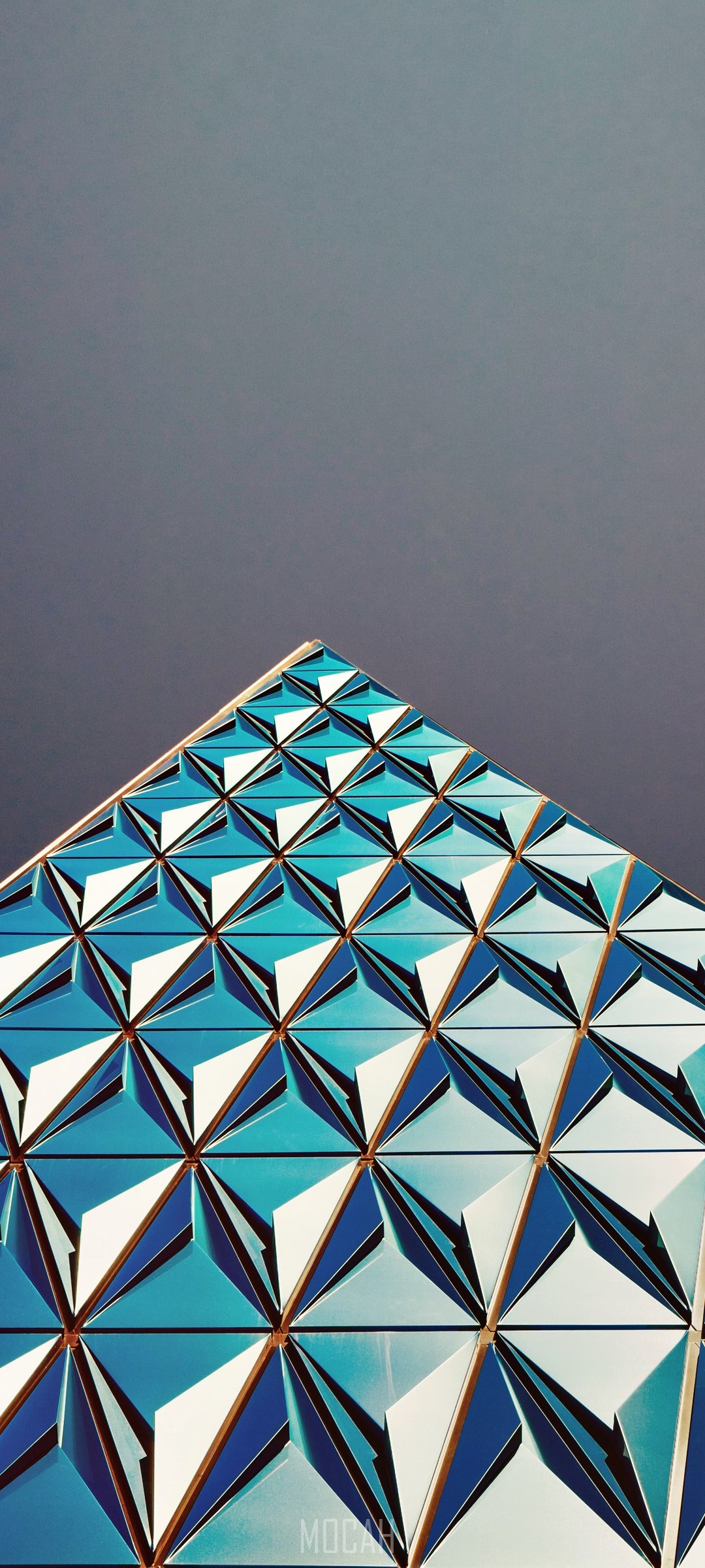 Geometric blue architecture against a dark sky HD Phone Wallpaper