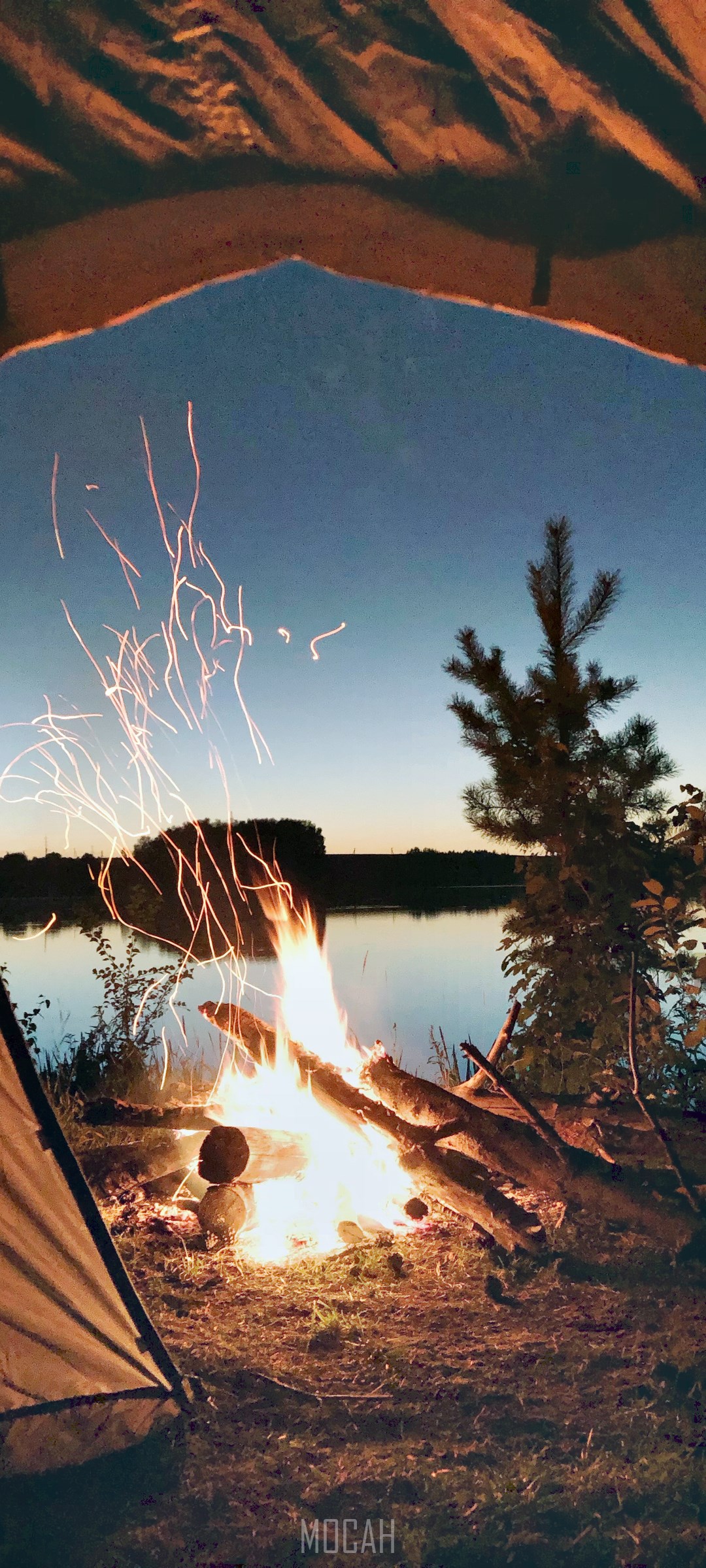 Camping by the lake with a bonfire at dusk HD Phone Wallpaper