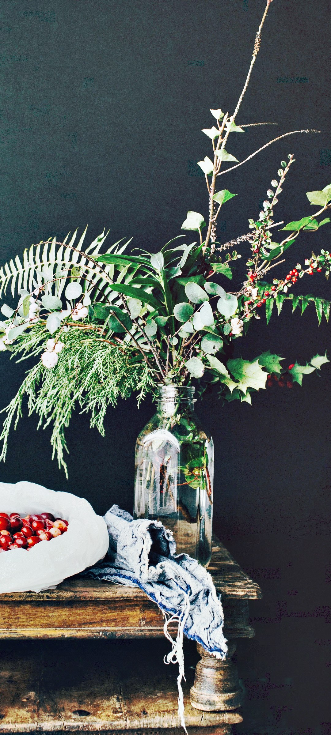 Holiday arrangement with berries and greenery in a vase HD Phone Wallpaper