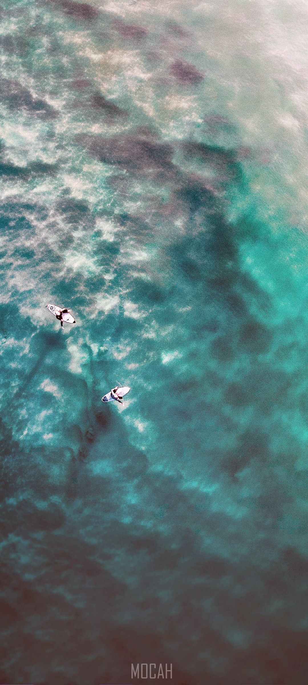 Two surfers on surfboards in the ocean HD Phone Wallpaper
