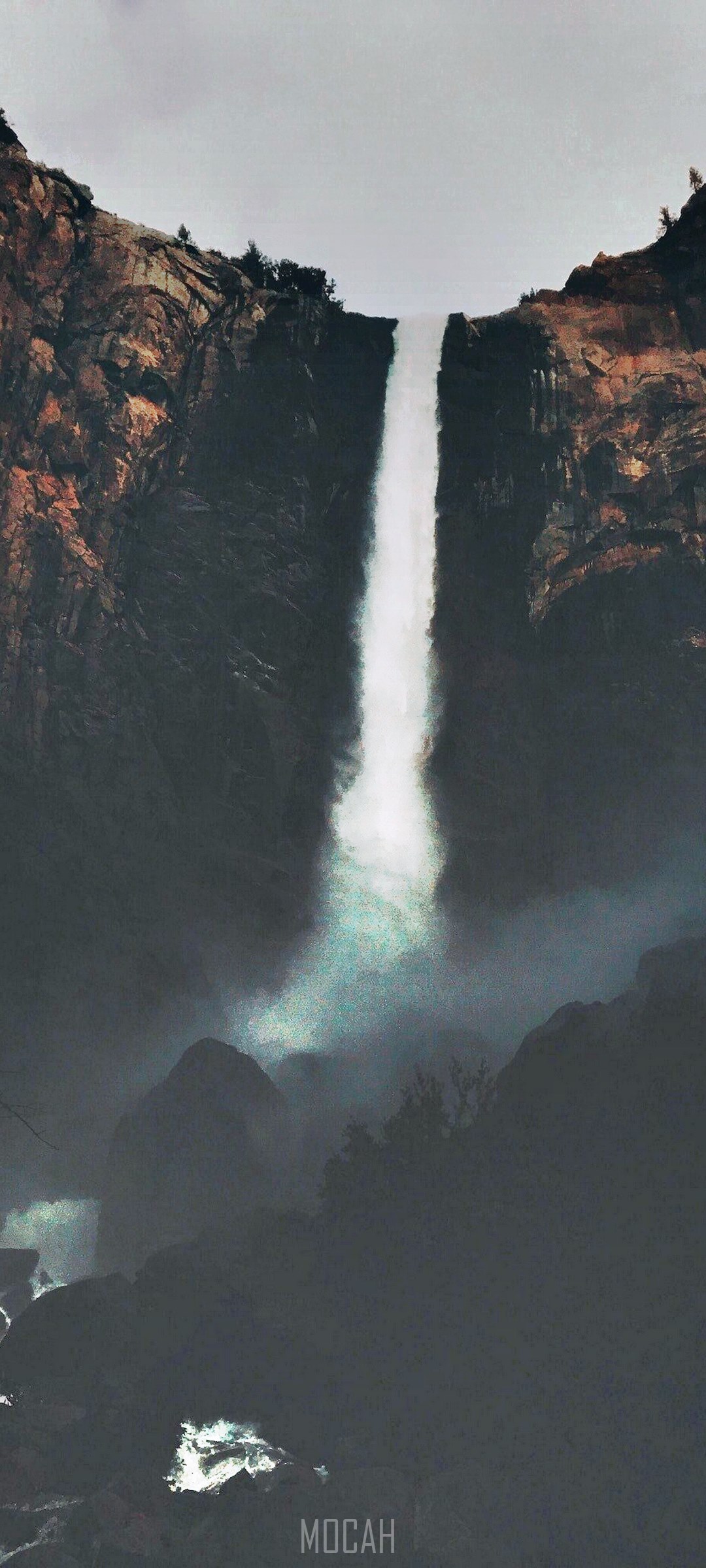 Waterfall cascading down rocky cliffs HD Phone Wallpaper