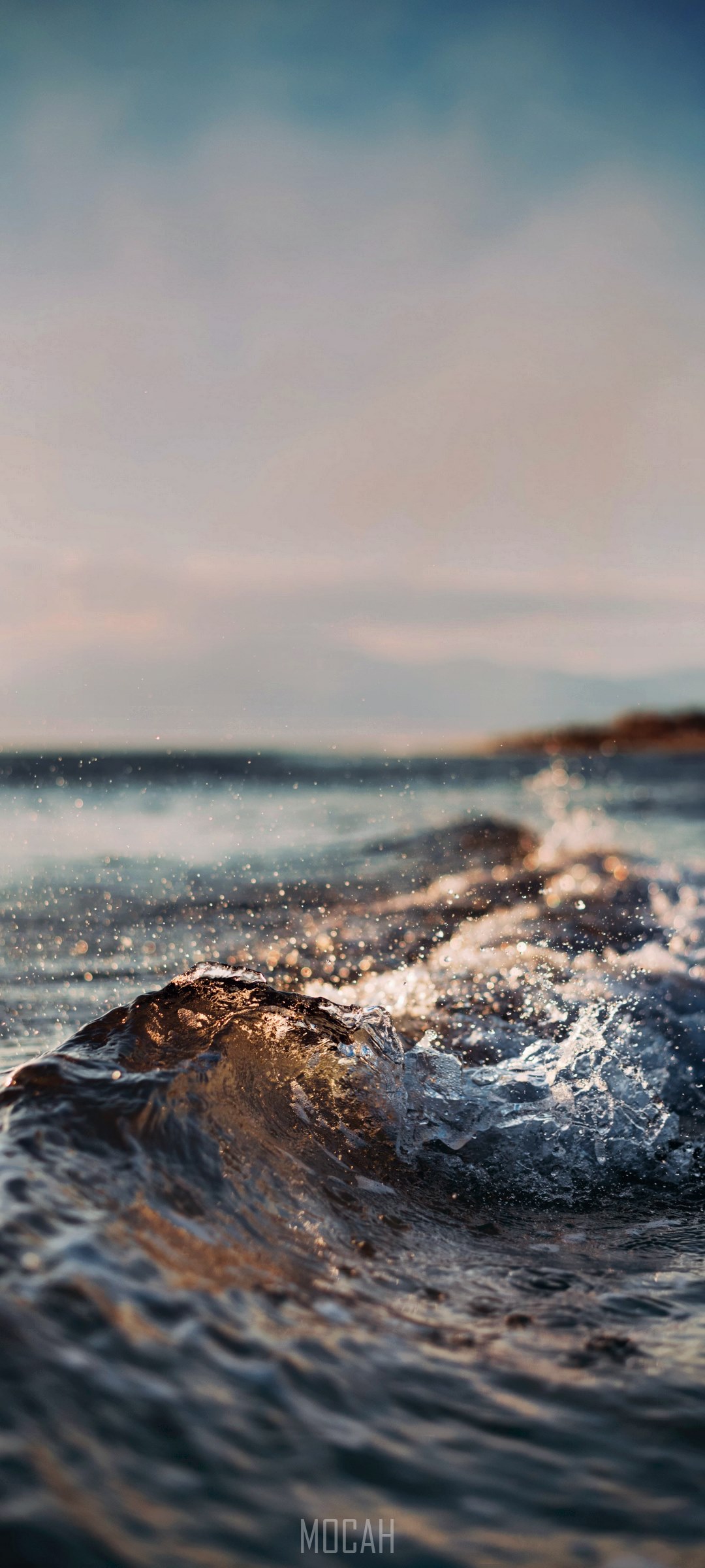 Close-up of a small wave crashing on a beach HD Phone Wallpaper