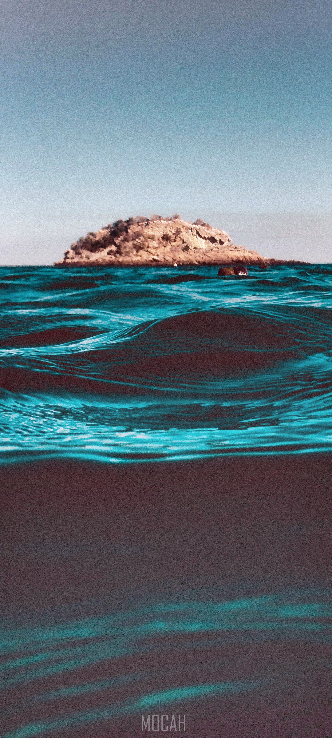 Island in the ocean with waves HD Phone Wallpaper