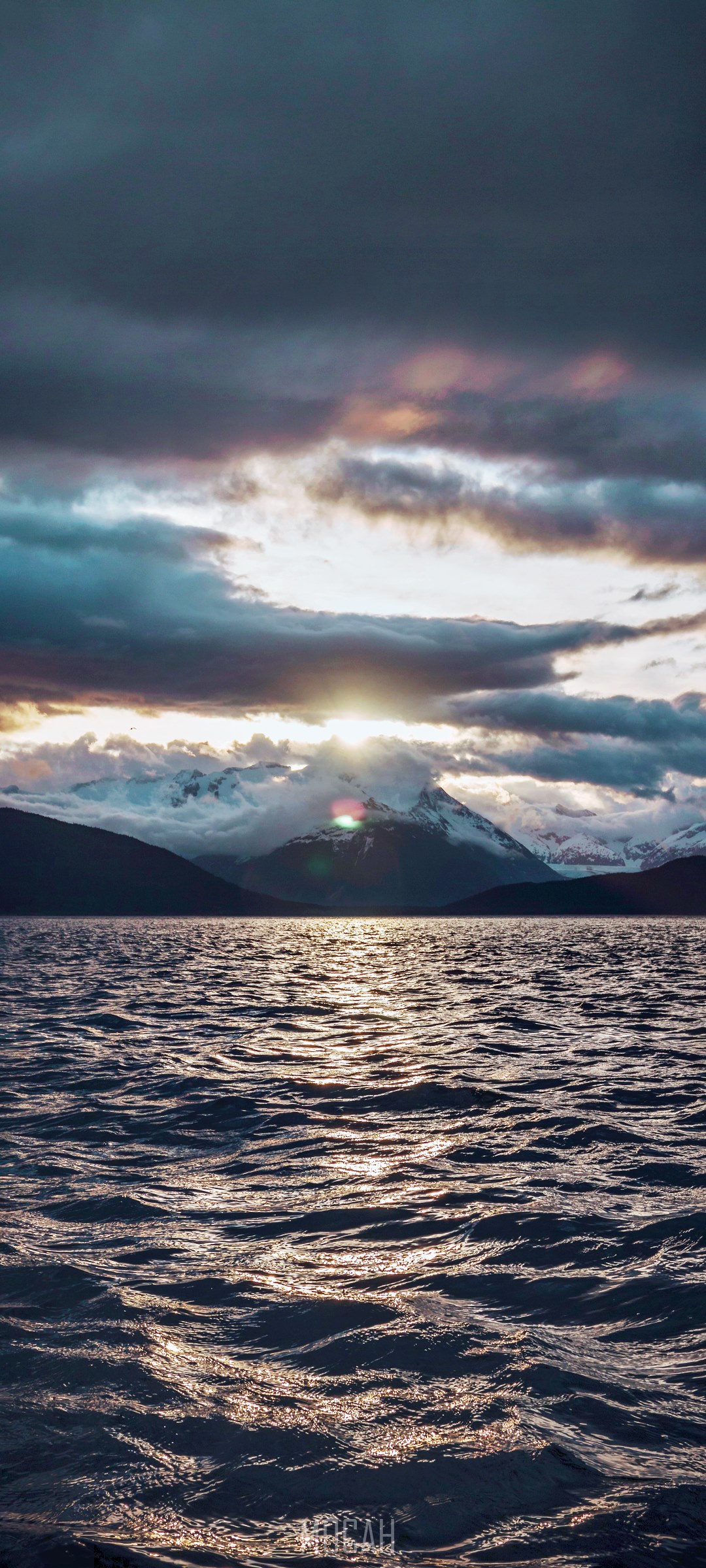 Sunset over mountains and water HD Phone Wallpaper