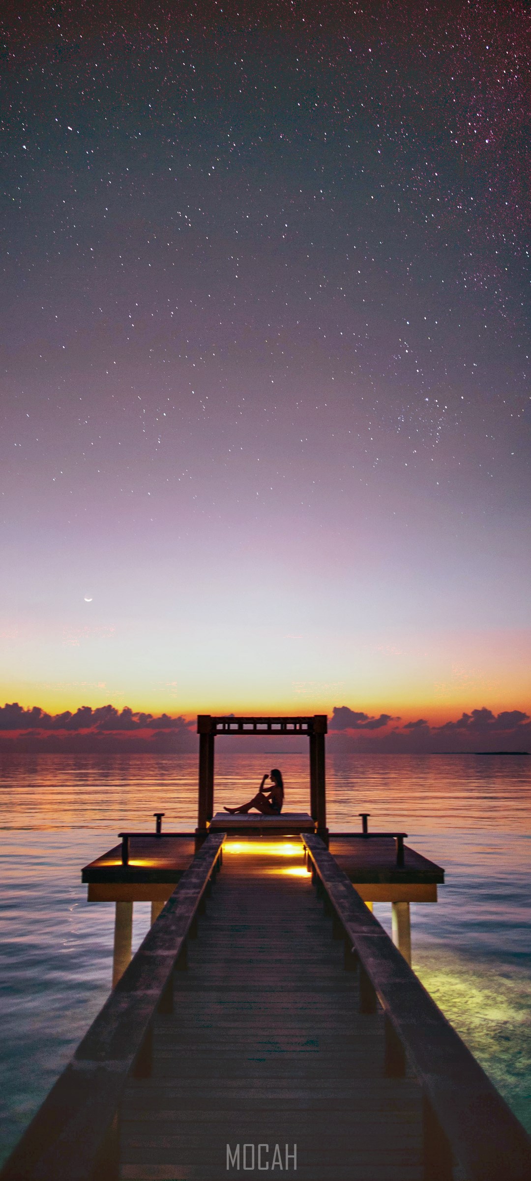Woman on a pier under starry sky at sunset HD Phone Wallpaper