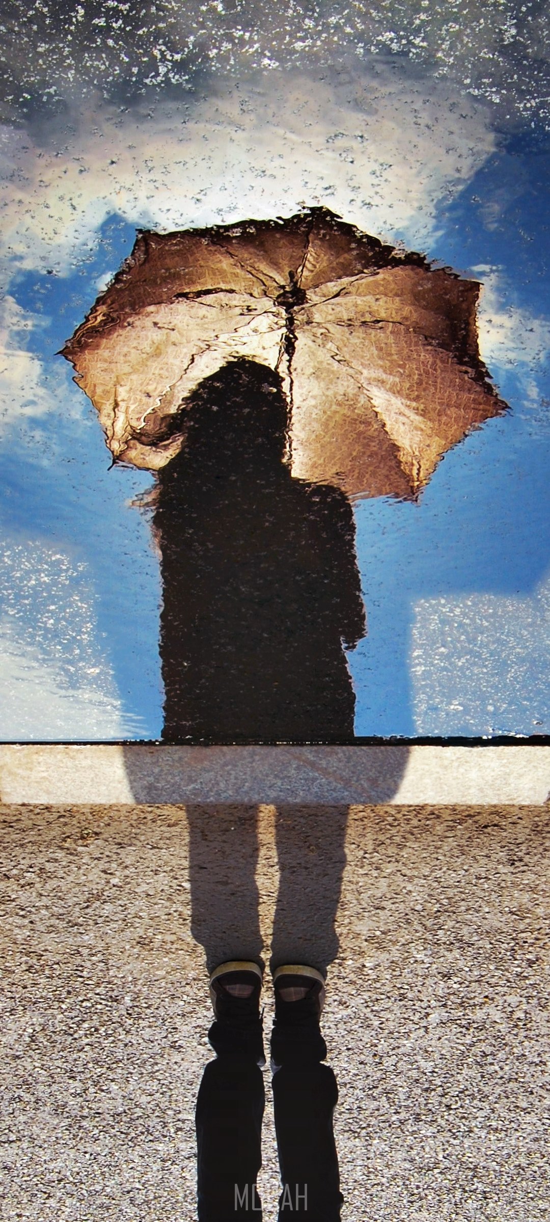Reflection of a person with an umbrella in a puddle HD Phone Wallpaper