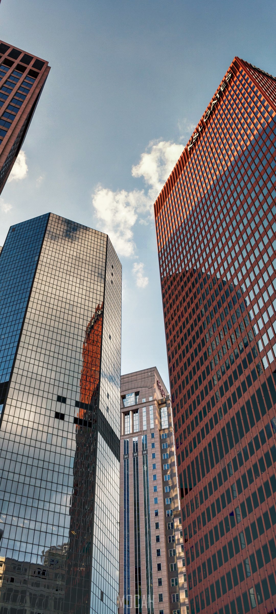 Skyscrapers against a cloudy sky HD Phone Wallpaper