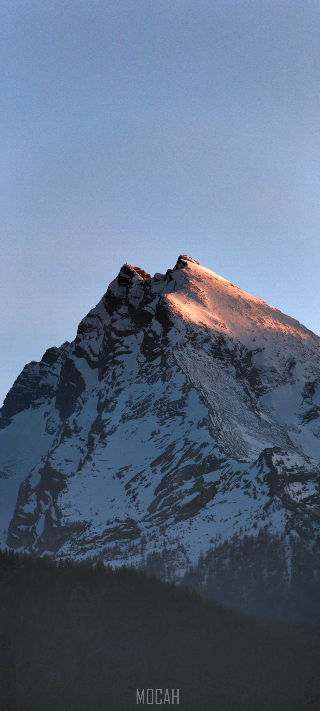 Mountain peak illuminated by first light HD Phone Wallpaper