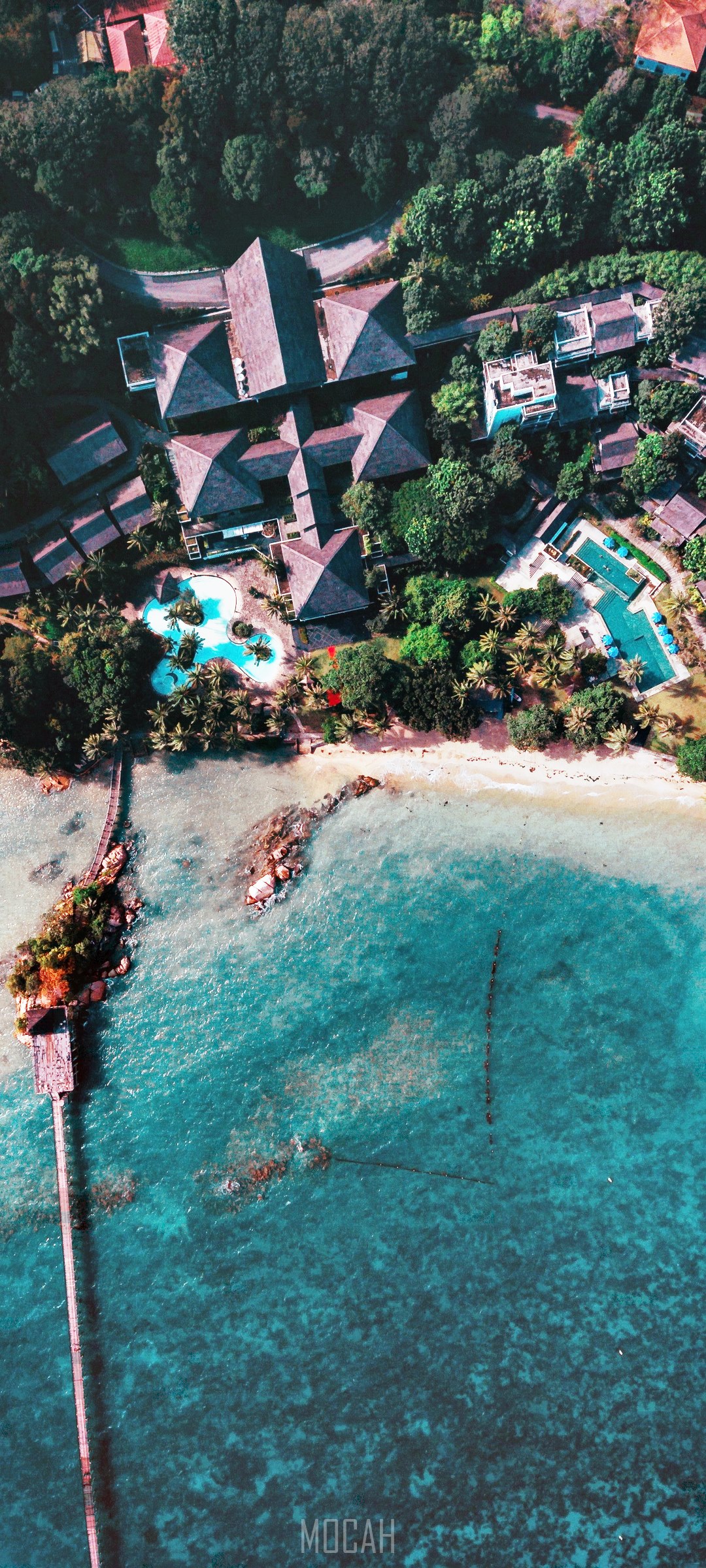 Aerial view of a tropical resort with a pier and beach HD Phone Wallpaper