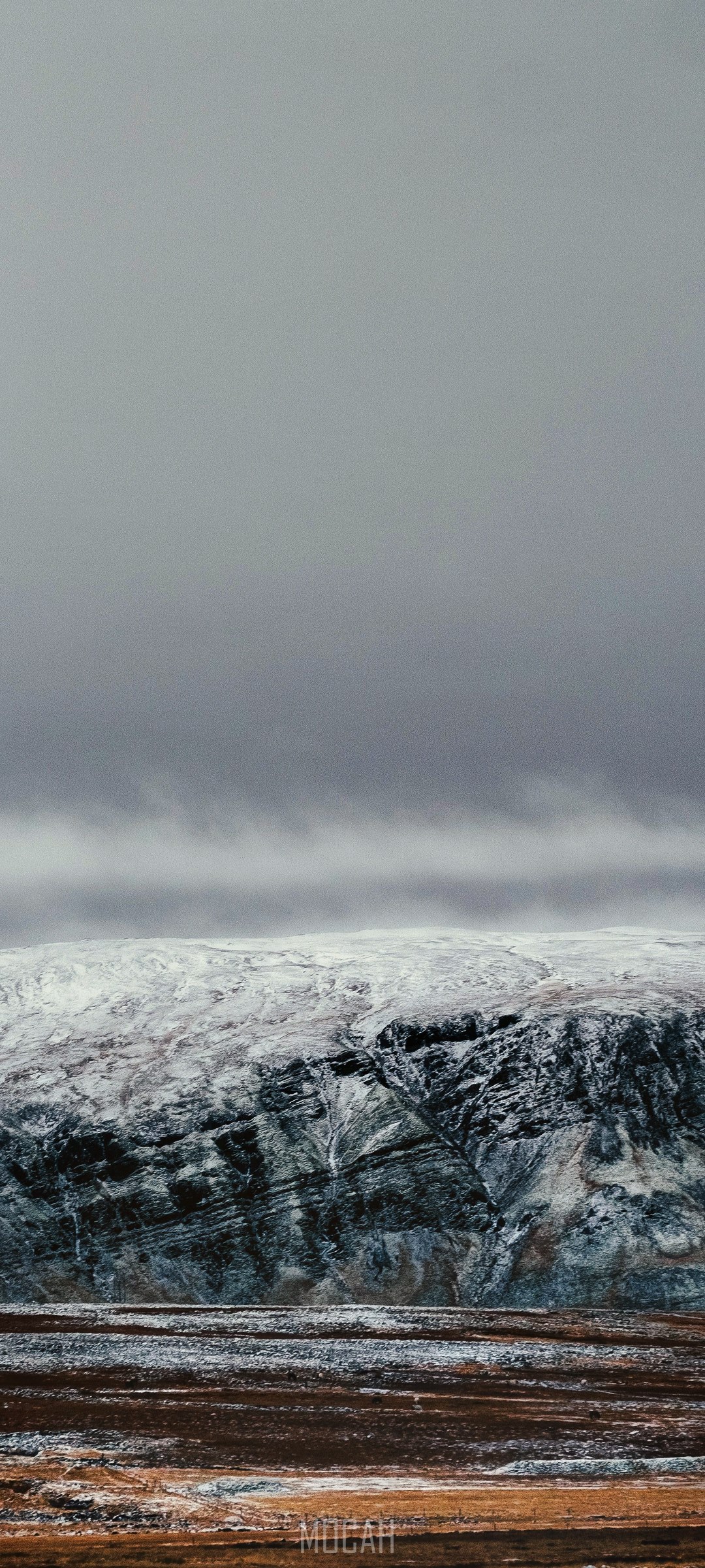 Snowy mountain landscape with overcast sky HD Phone Wallpaper