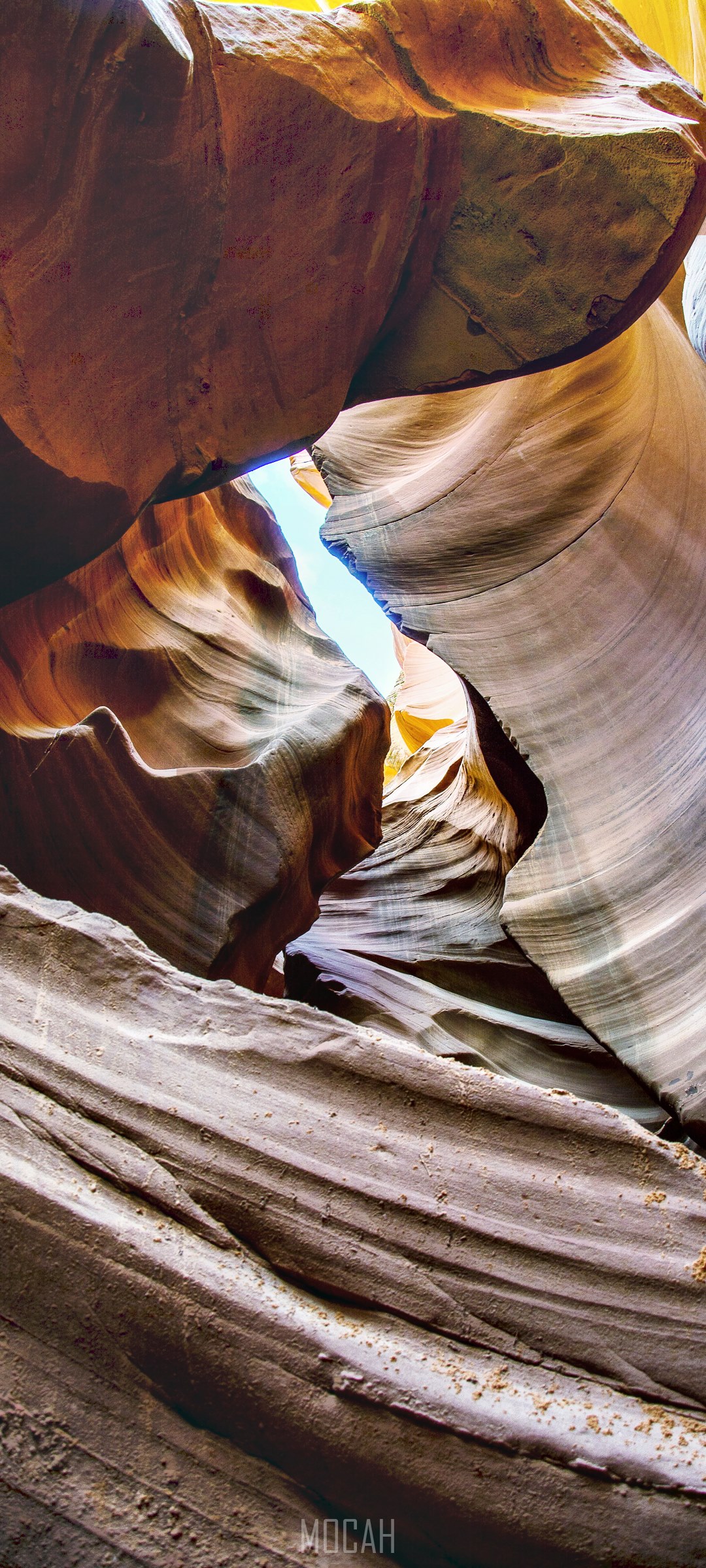 Antelope Canyon rock formations against blue sky HD Phone Wallpaper