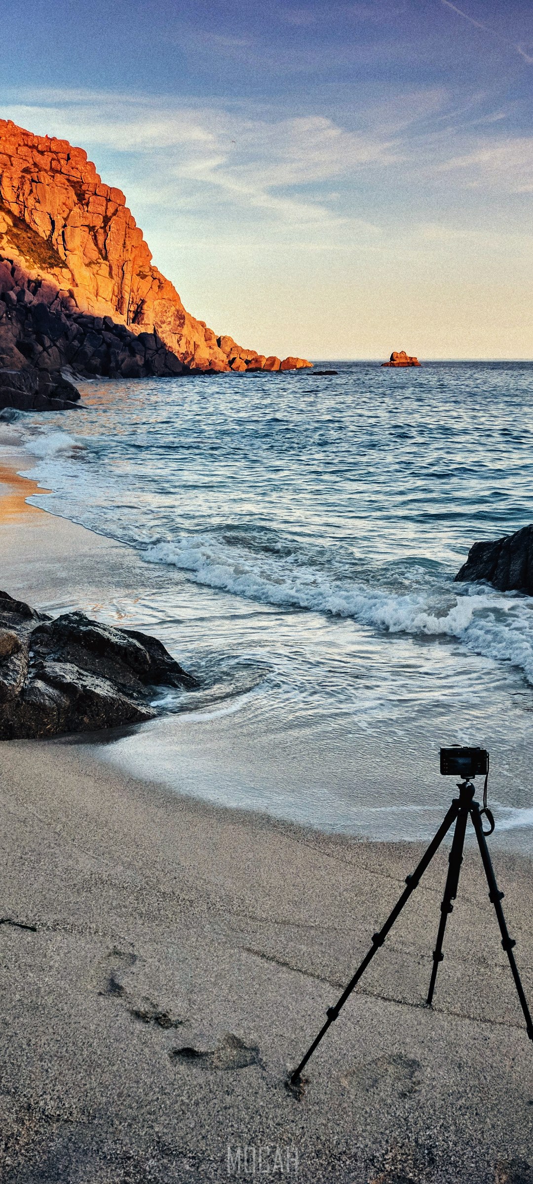 Tripod and camera on a beach with waves and cliffs HD Phone Wallpaper