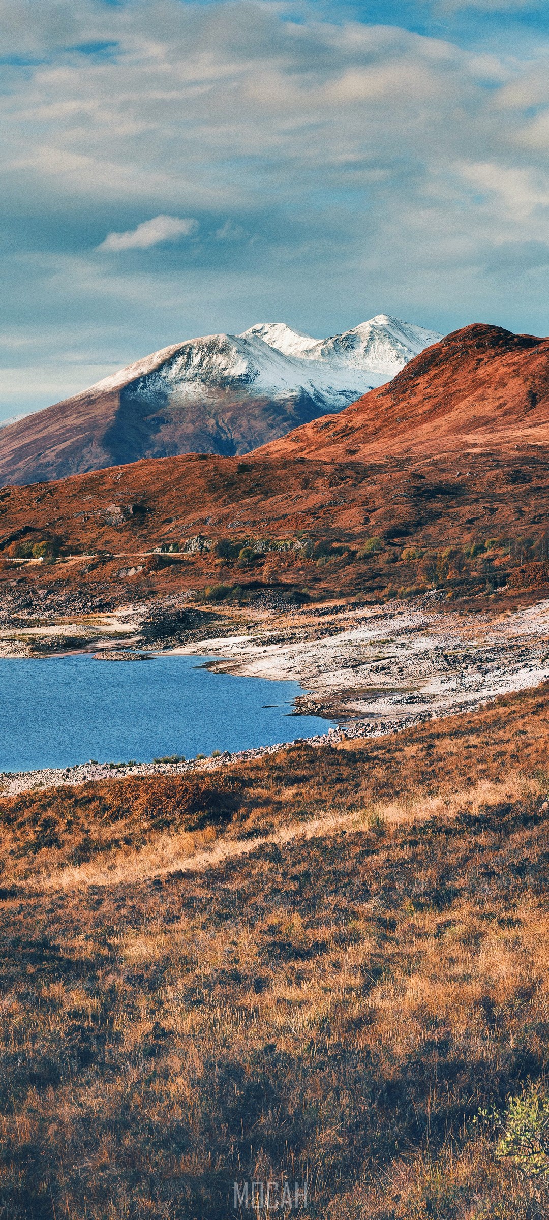 Snow-capped mountains overlooking a loch in the Highlands HD Phone Wallpaper