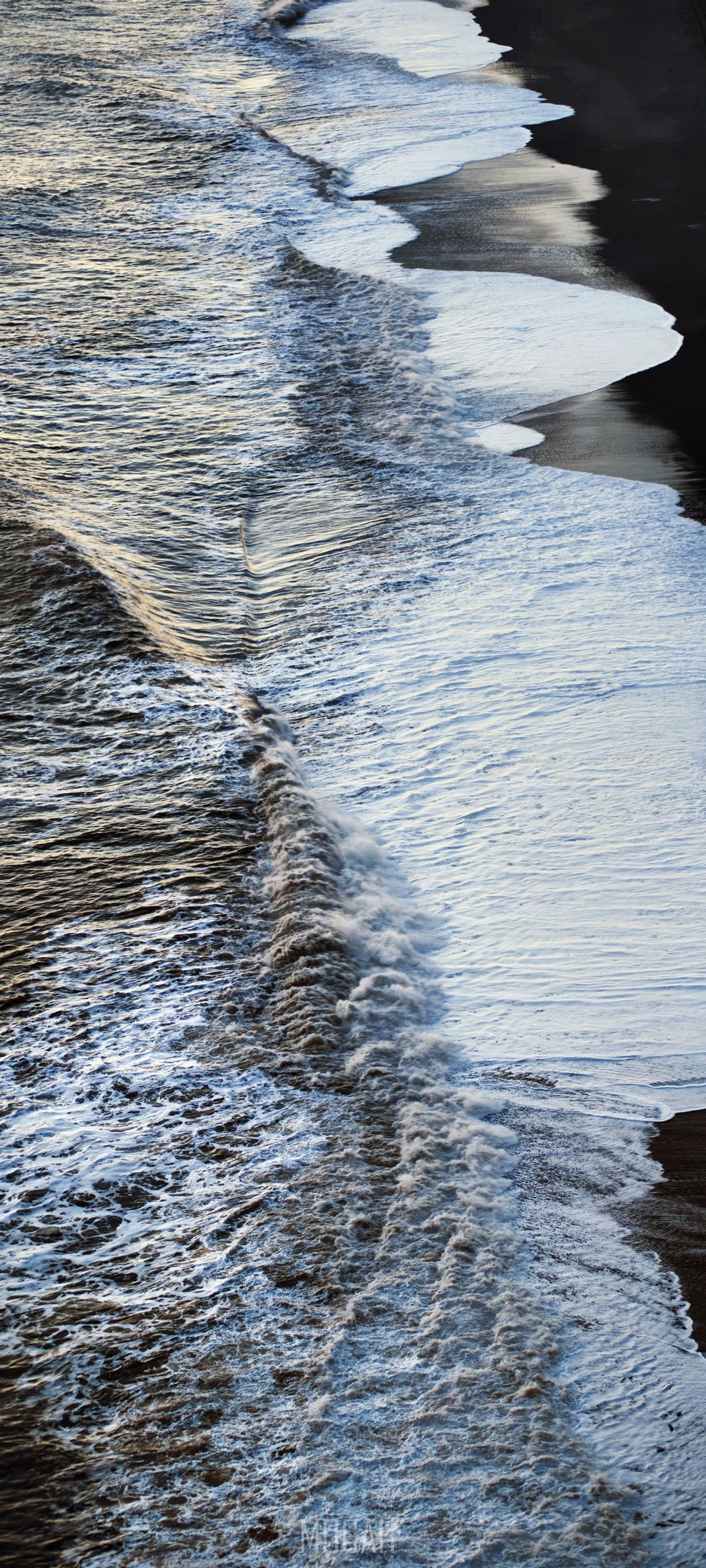 Waves crashing on black sand beach HD Phone Wallpaper