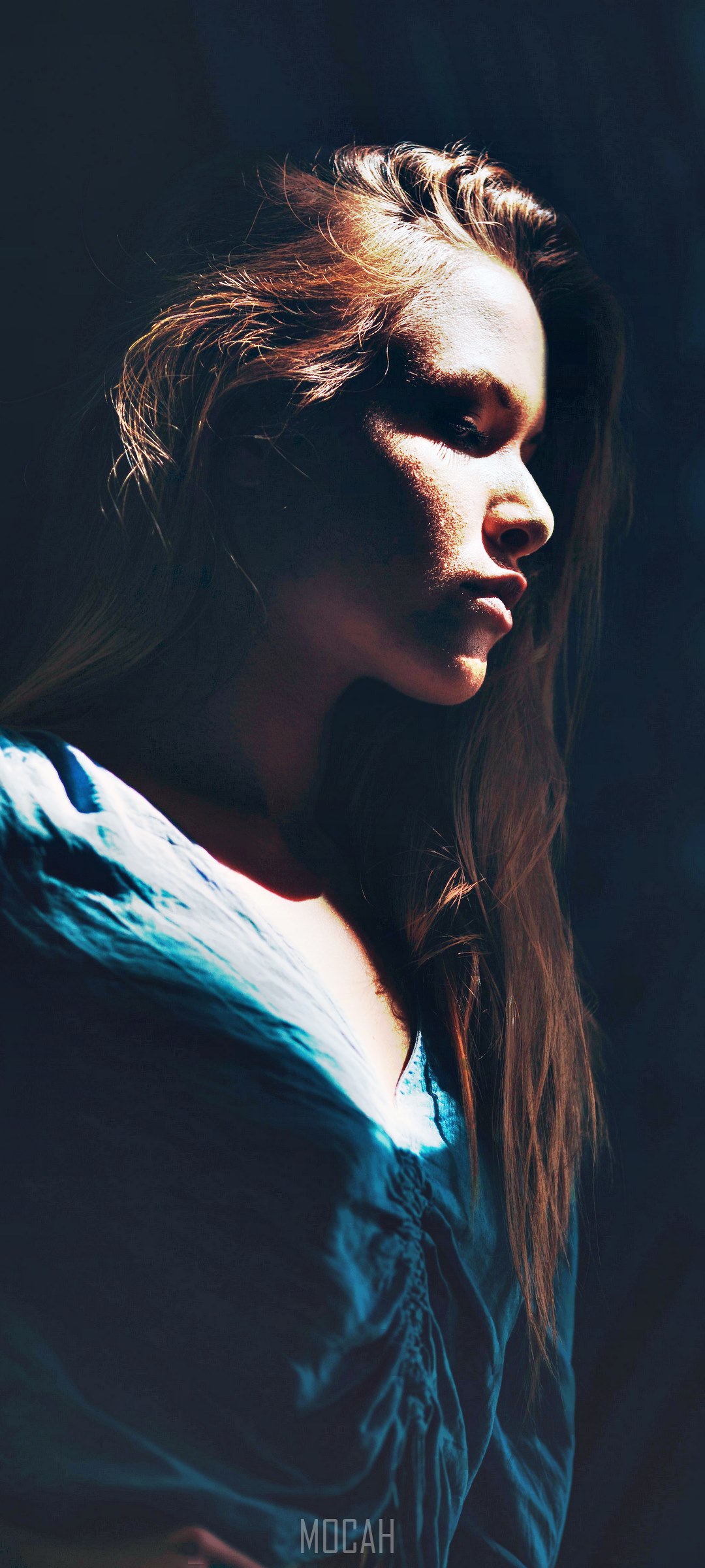 Woman in blue shirt with dramatic lighting HD Phone Wallpaper