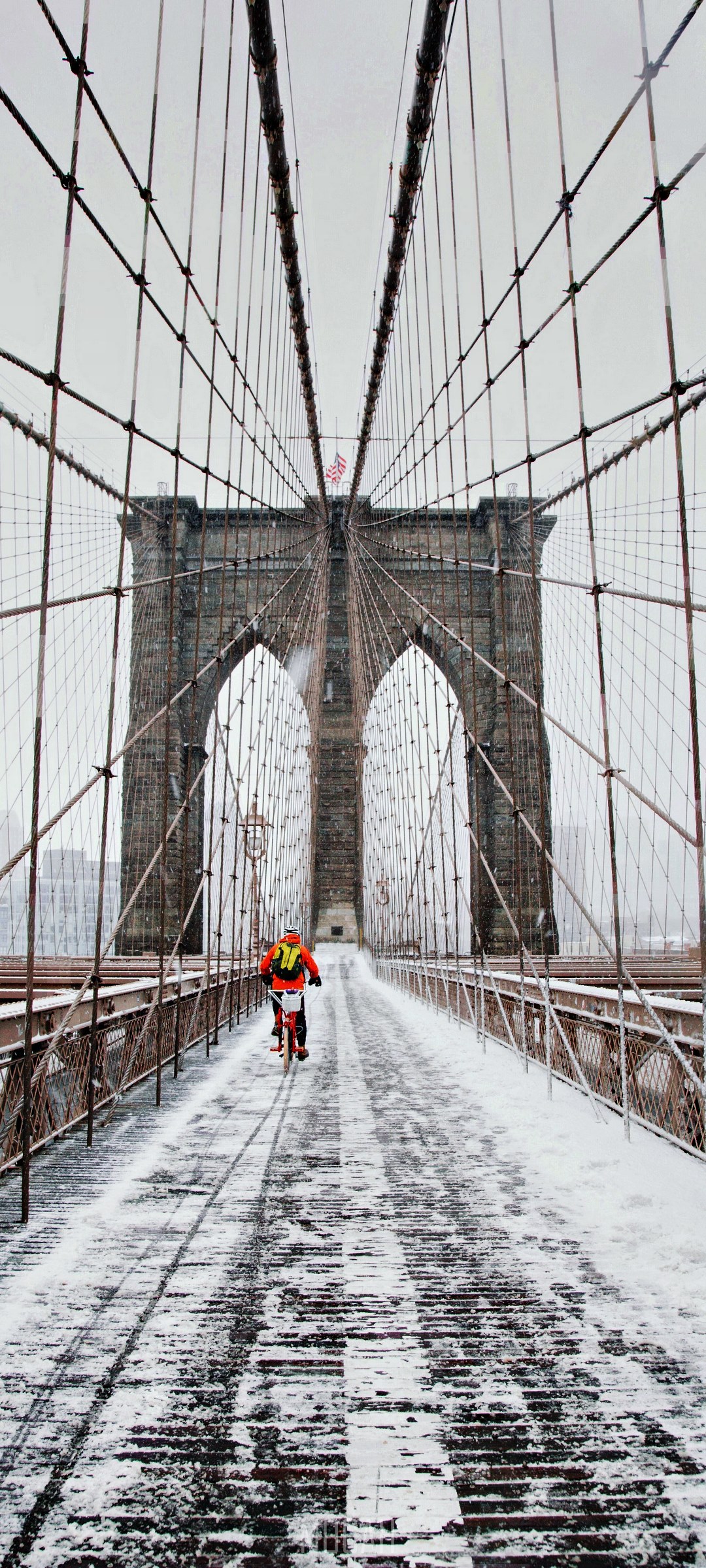 Cyclist on Brooklyn Bridge in Snow HD Phone Wallpaper