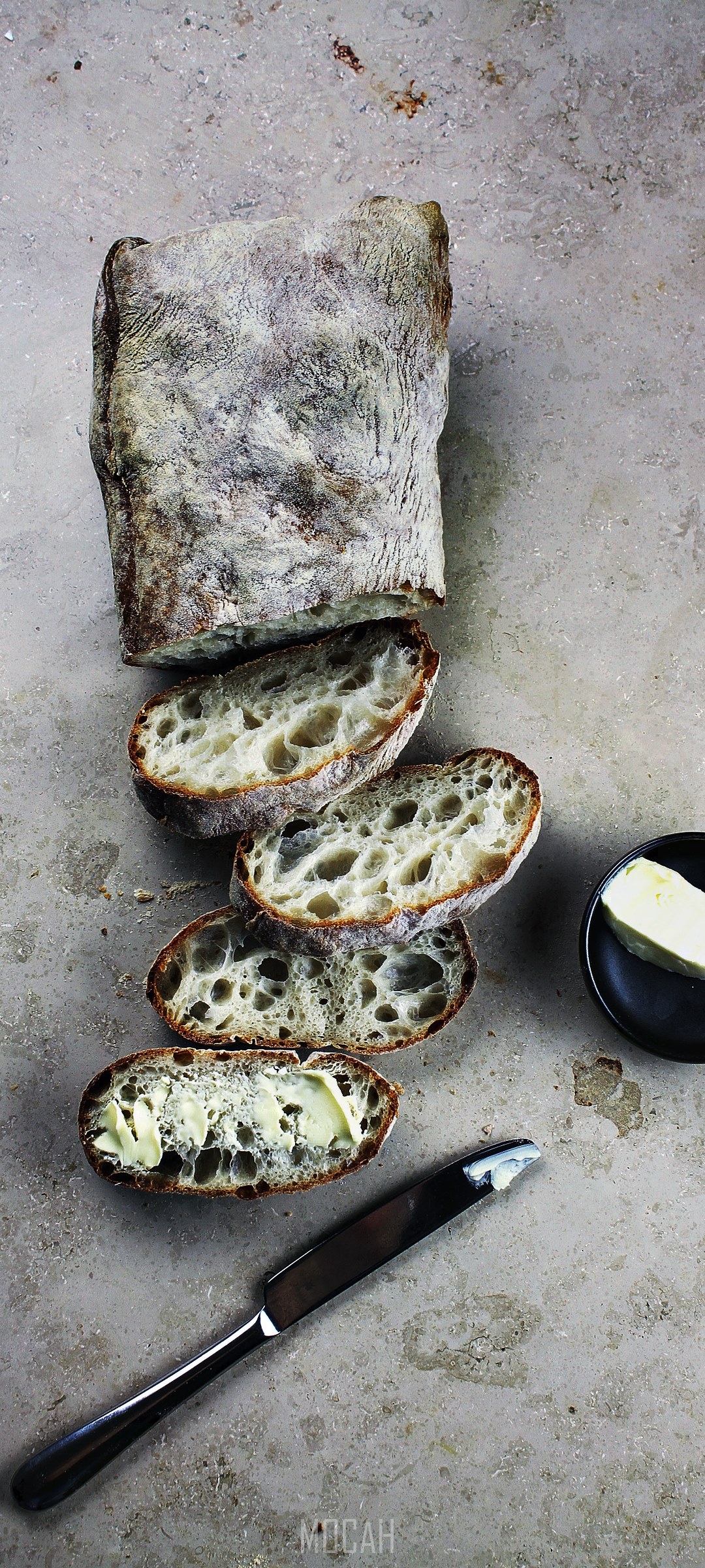 Ciabatta bread with butter and knife HD Phone Wallpaper