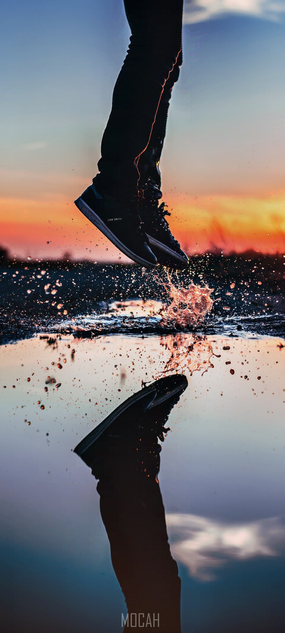 Person jumping through water with reflection HD Phone Wallpaper