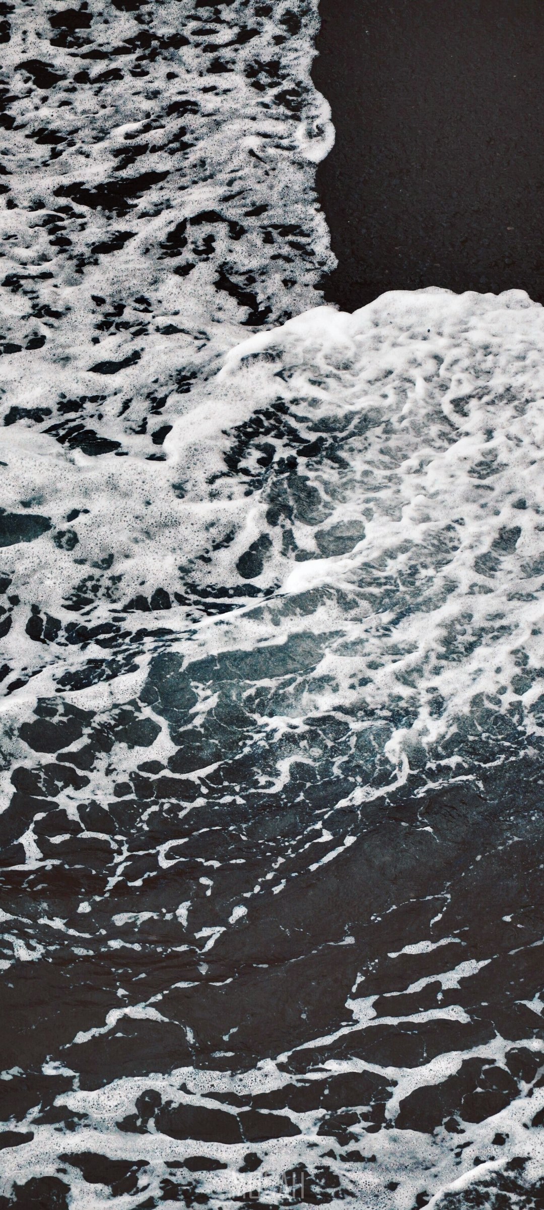 Waves crashing on a dark volcanic beach HD Phone Wallpaper