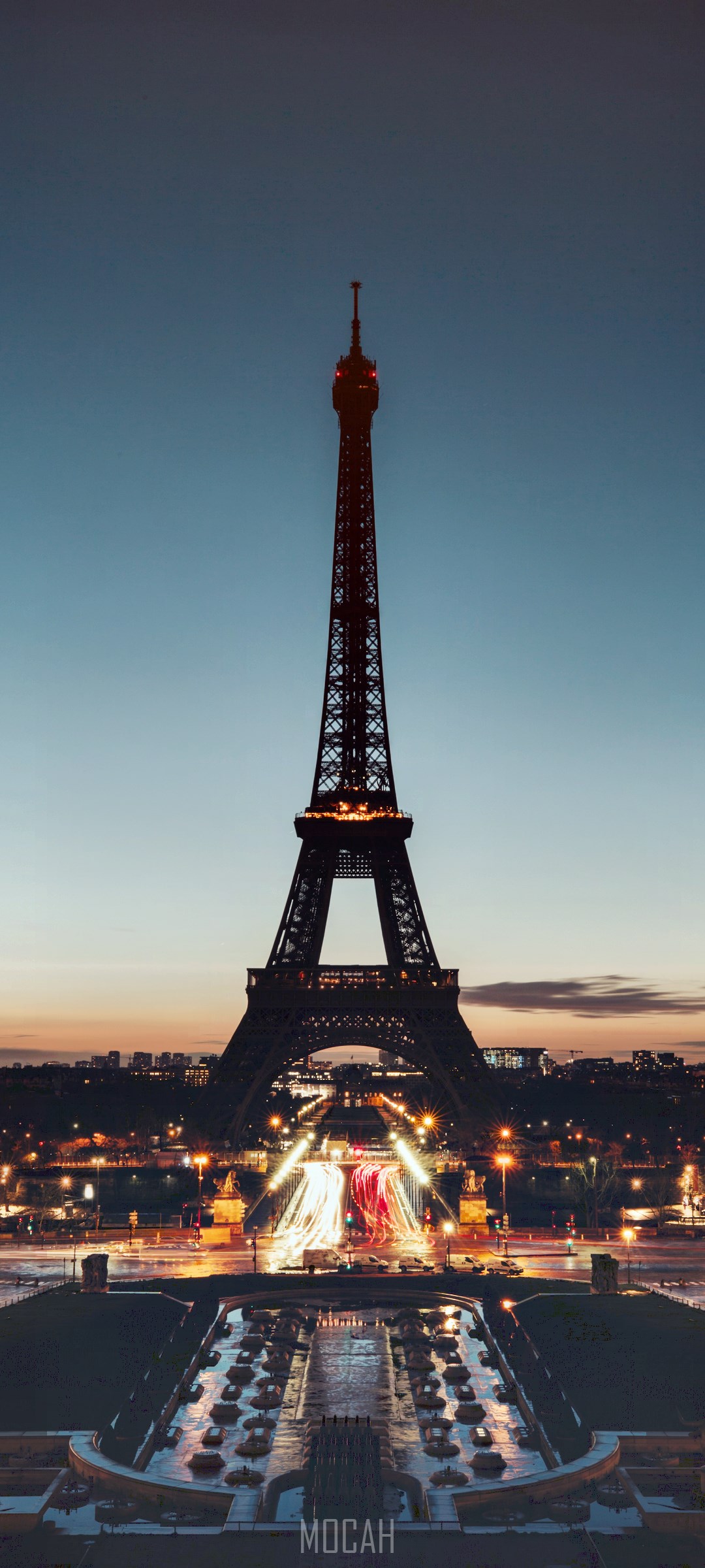 Eiffel Tower at night with city lights and fountain HD Phone Wallpaper