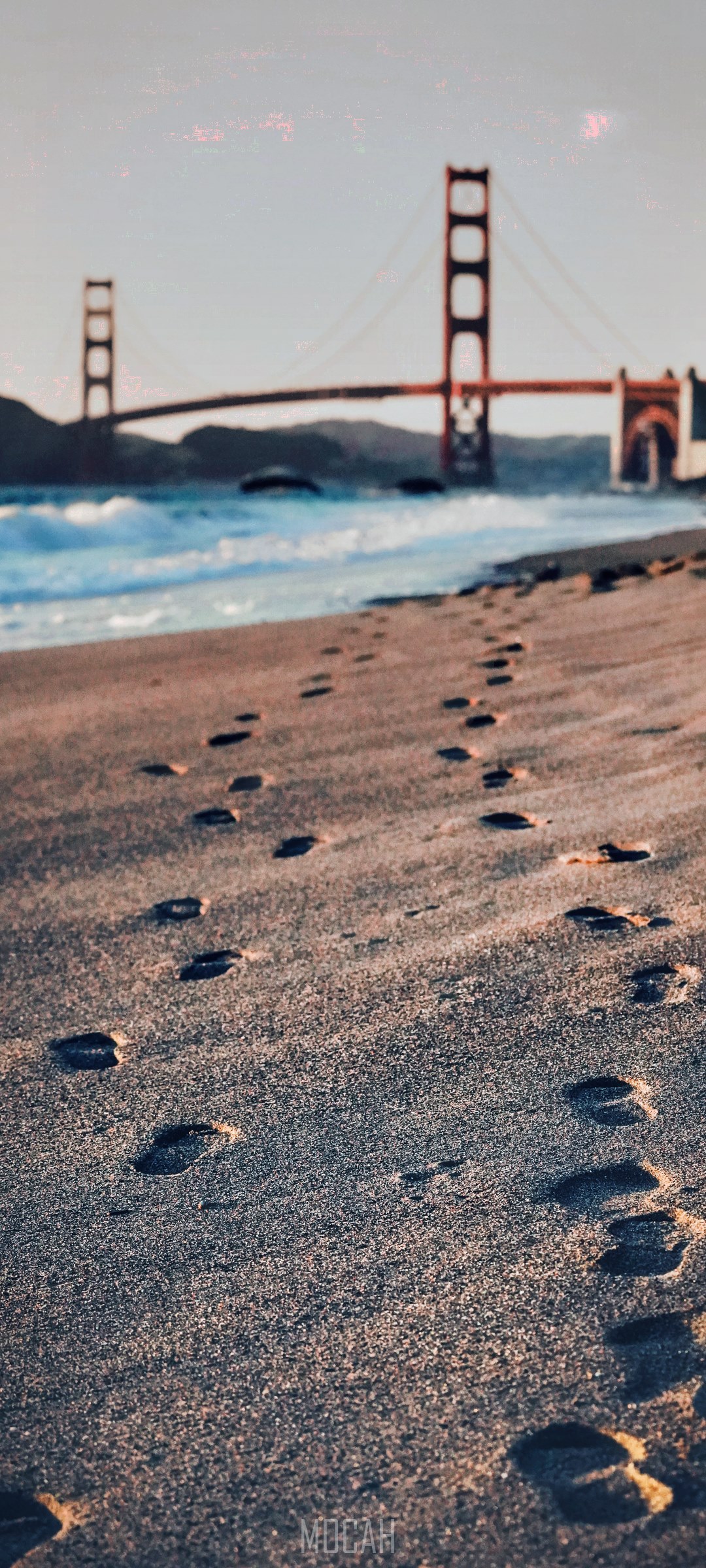 Footprints on beach with Golden Gate Bridge HD Phone Wallpaper