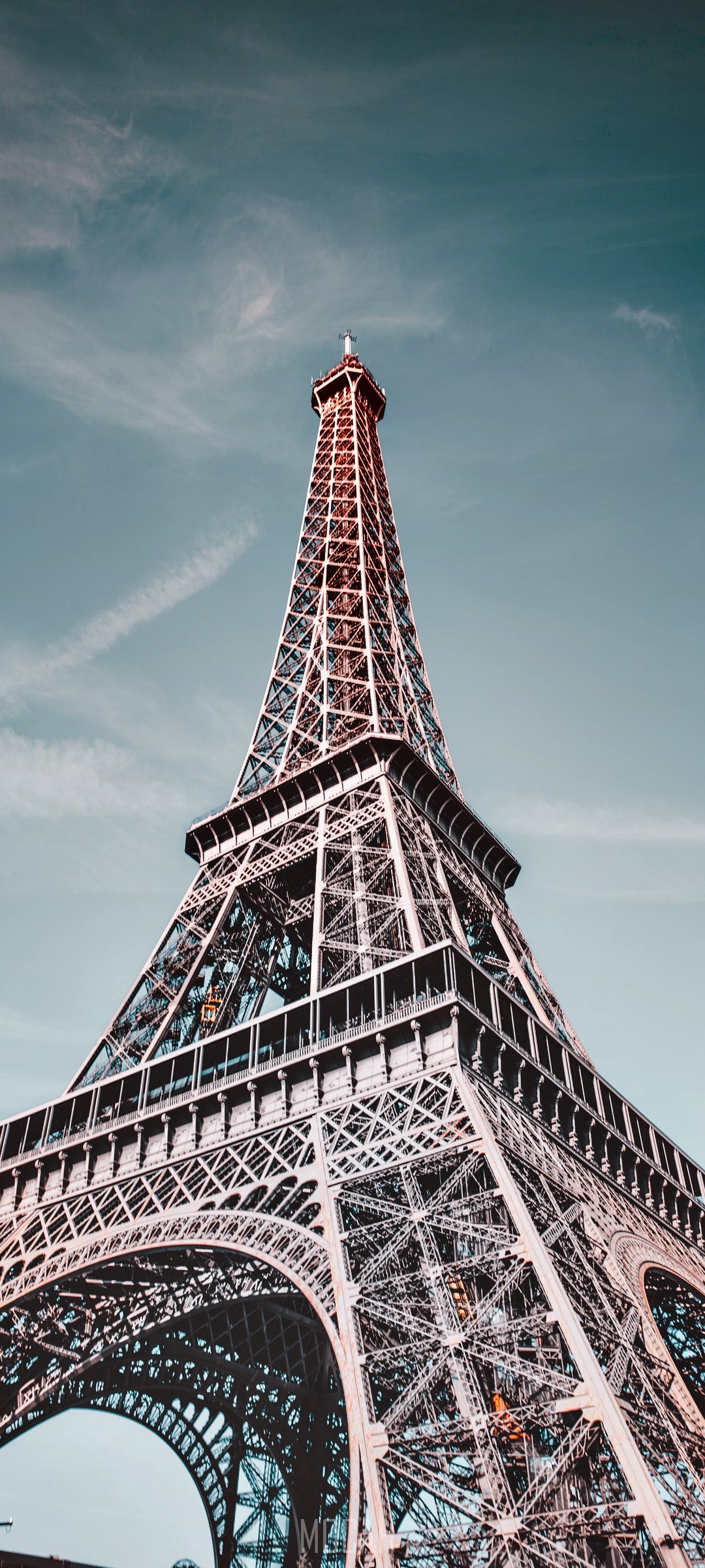 Eiffel Tower in Paris against a blue sky HD Phone Wallpaper