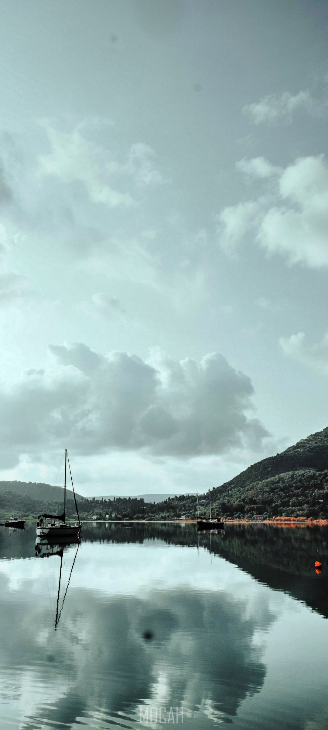 Sailboats on a calm lake with forested hills HD Phone Wallpaper