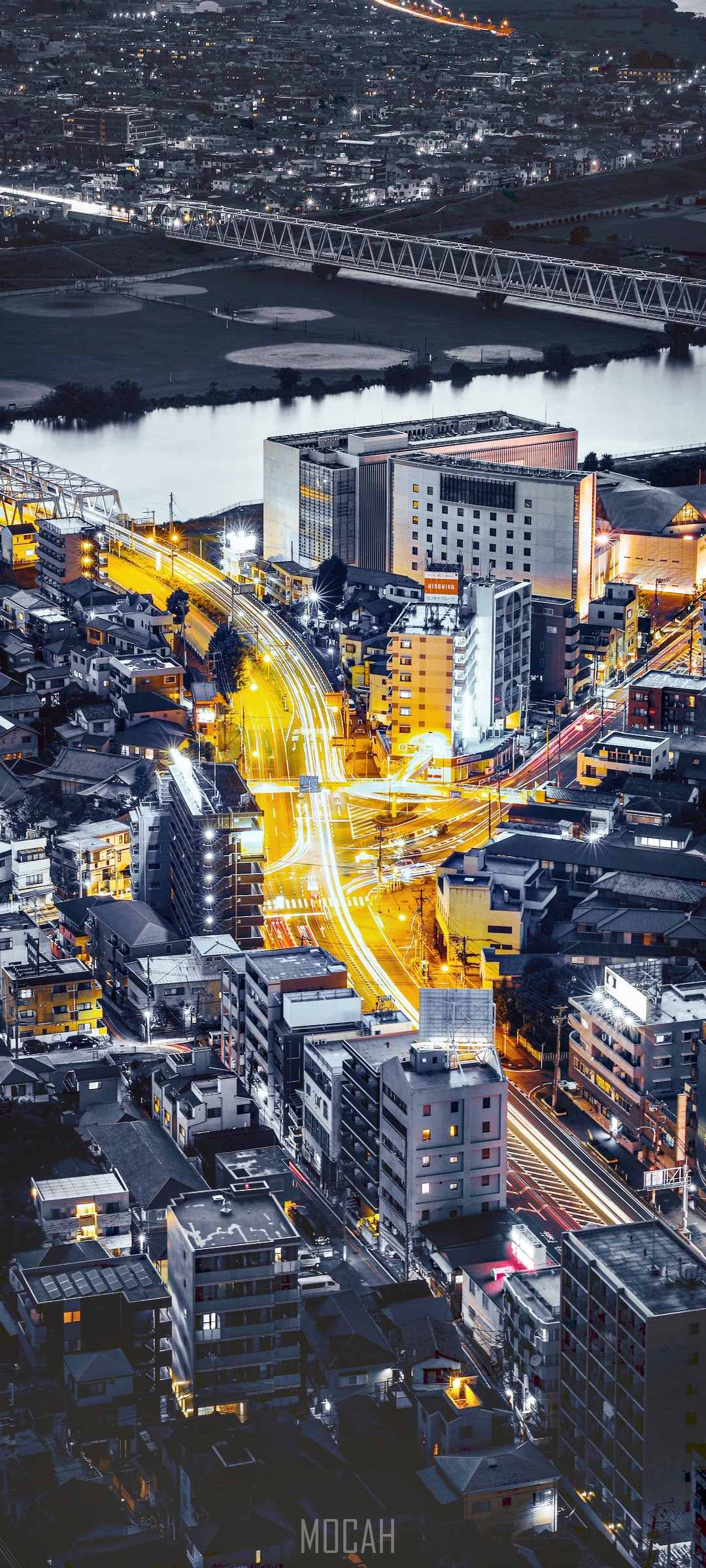 Night cityscape with illuminated roads and buildings HD Phone Wallpaper