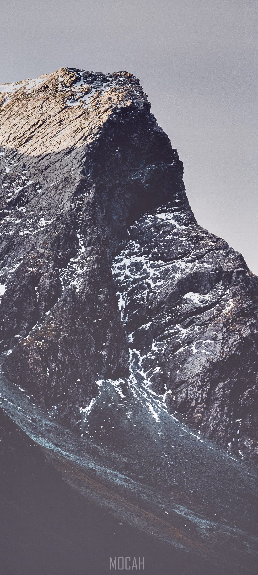 Close-up of a rocky mountain peak with snow HD Phone Wallpaper