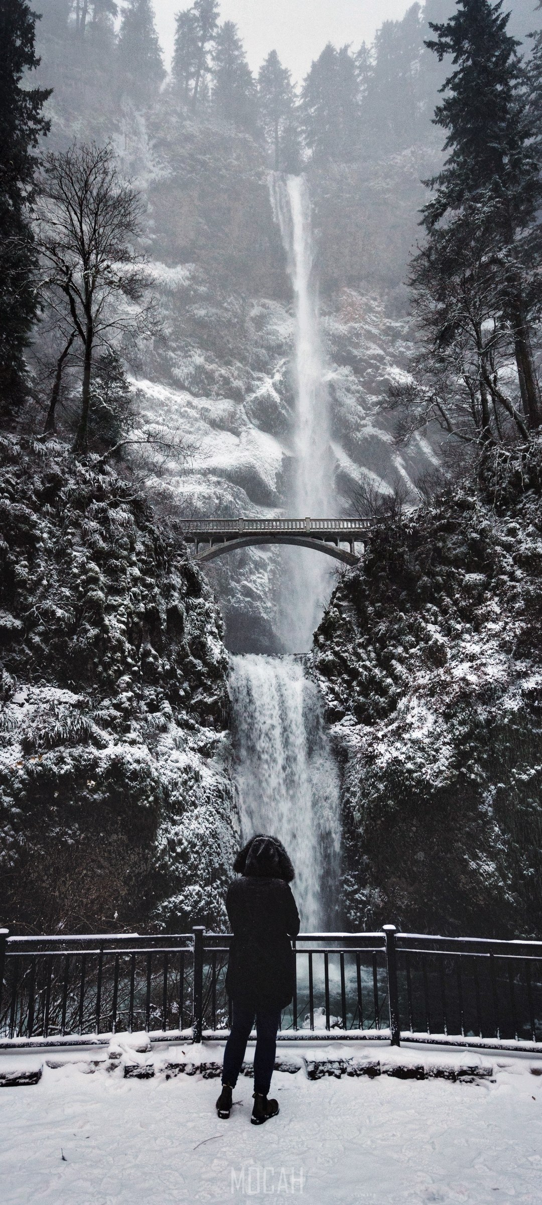 Person at Multnomah Falls in Winter HD Phone Wallpaper