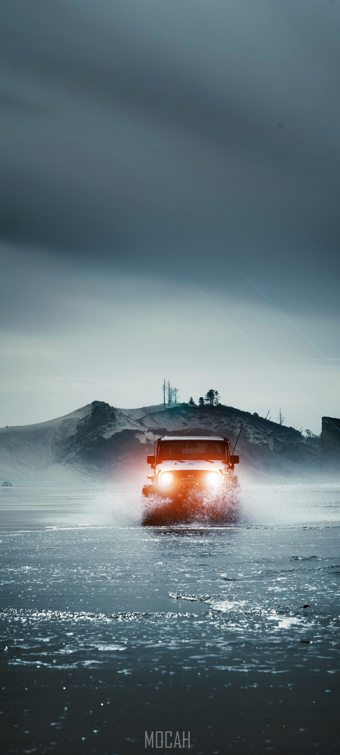 Jeep driving through icy water with mountains in background HD Phone Wallpaper