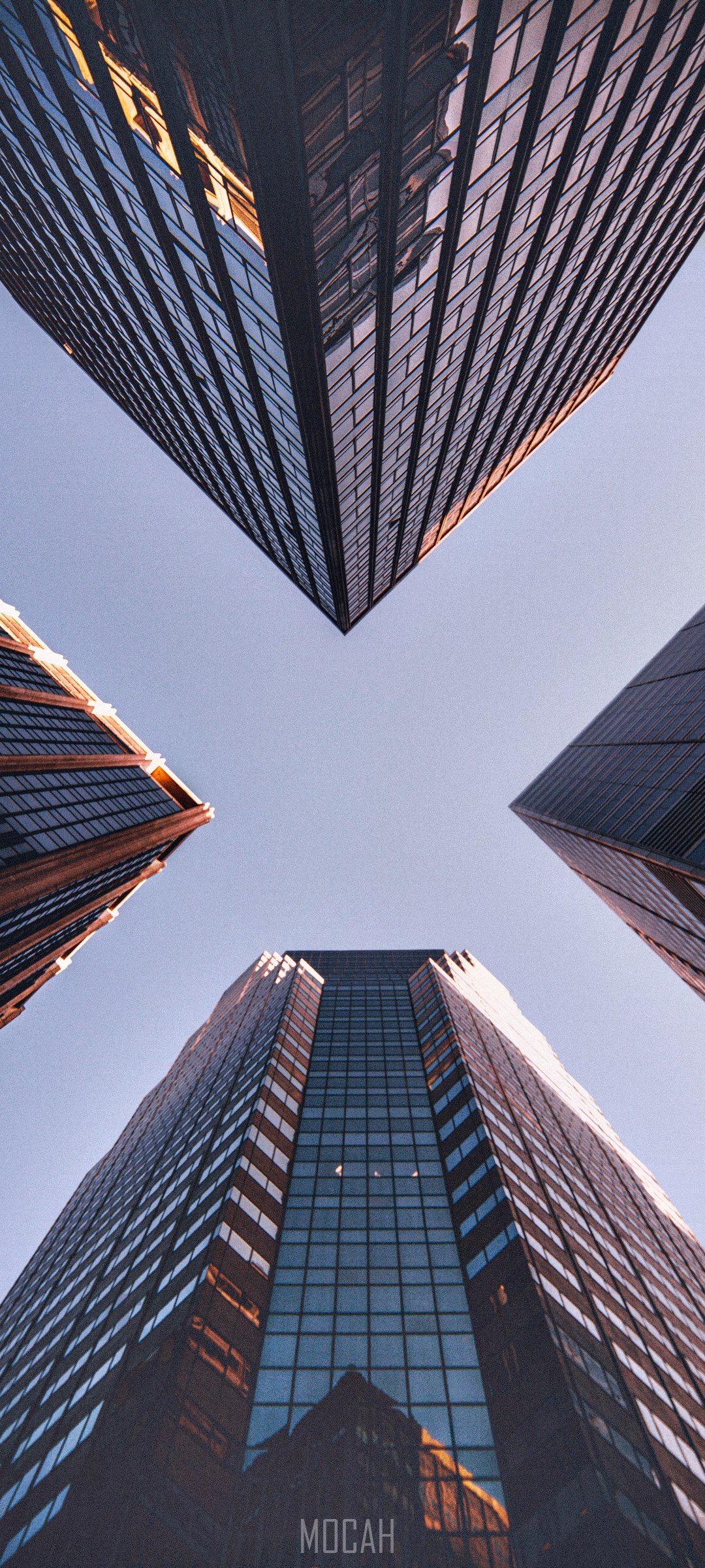 Four skyscrapers viewed from below HD Phone Wallpaper