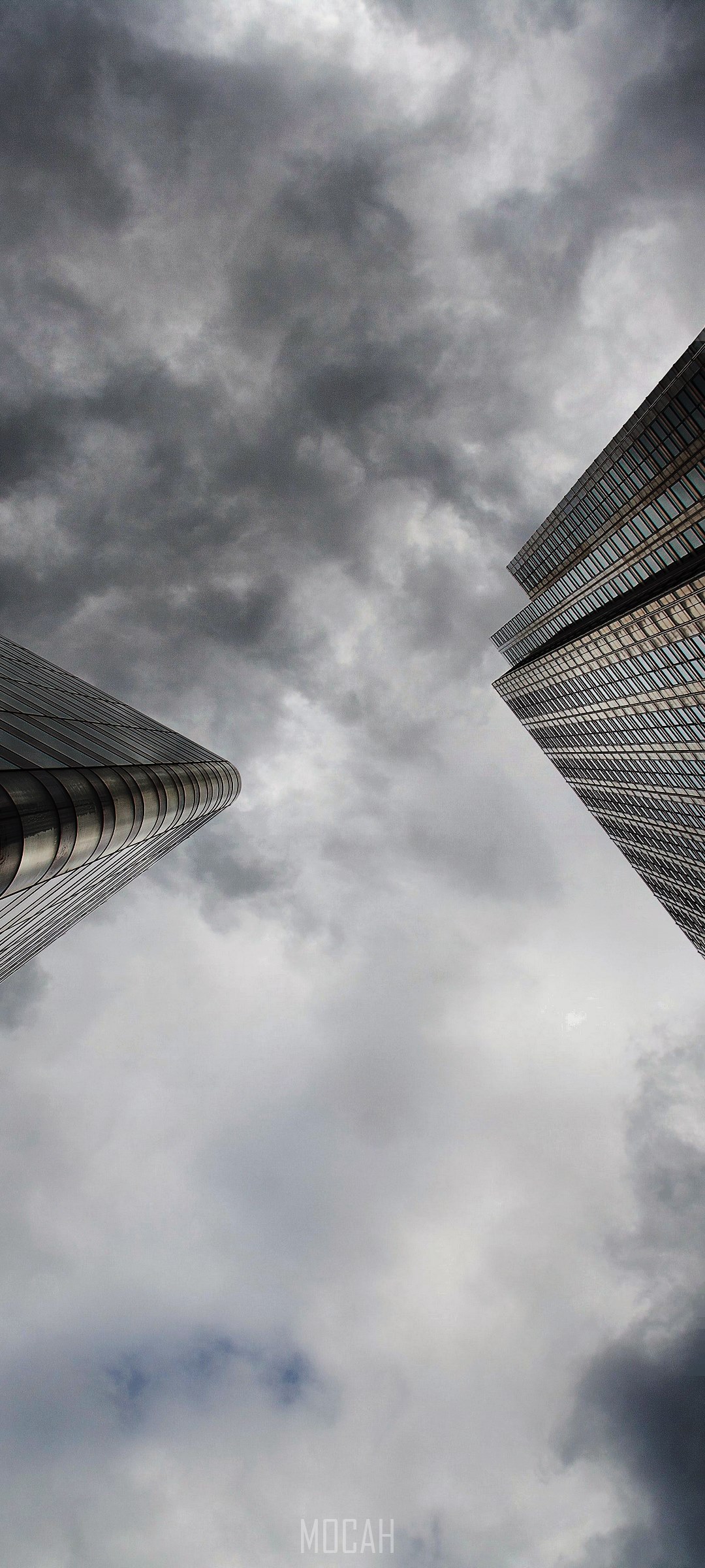Two skyscrapers against a cloudy sky HD Phone Wallpaper