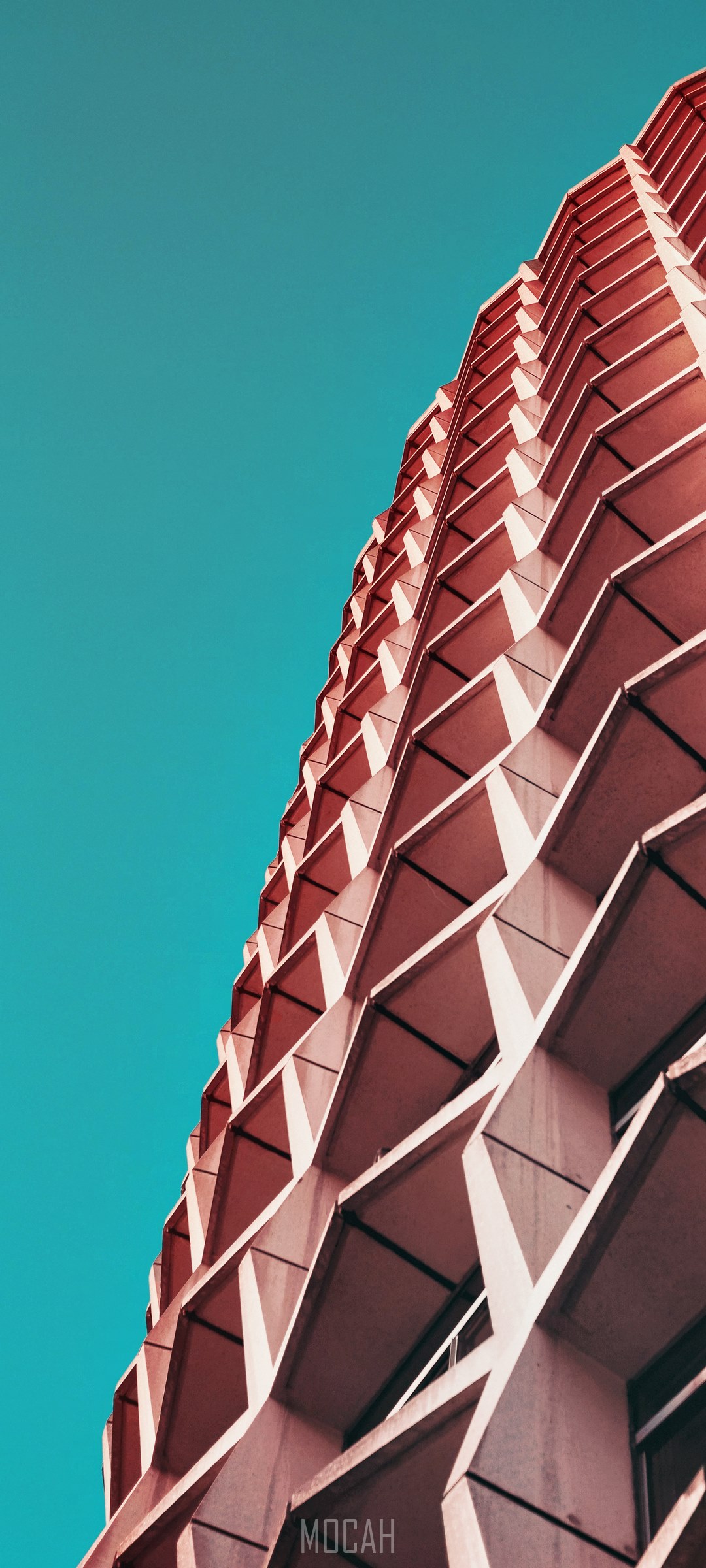 Modern building facade against a blue sky HD Phone Wallpaper