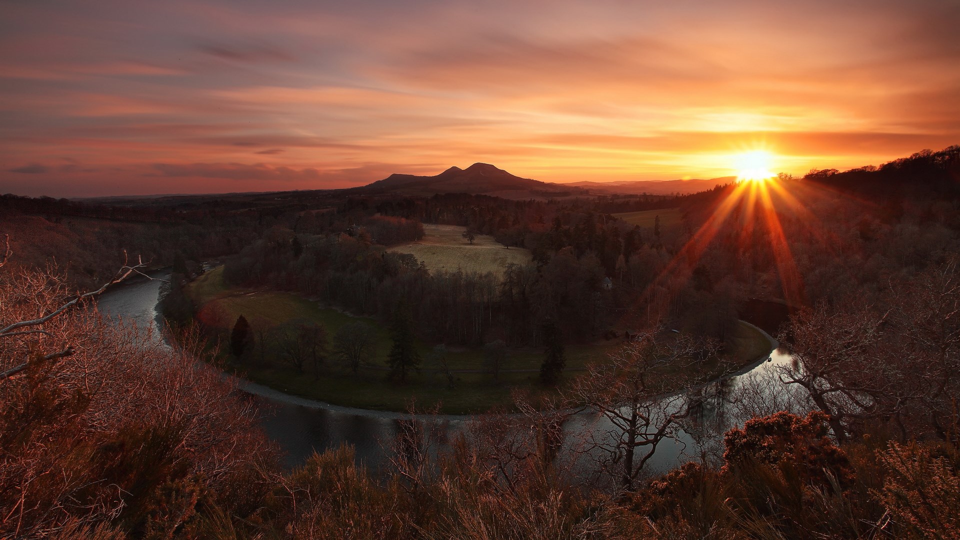 Sunset over a winding river and hills HD Wallpaper