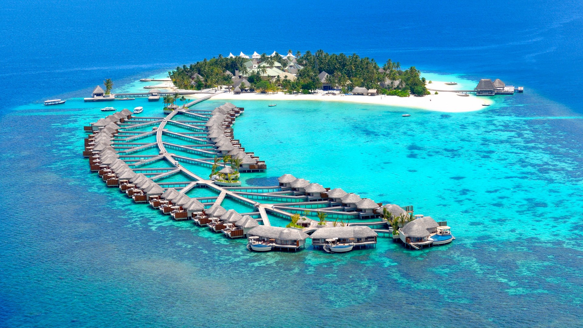 Overwater bungalows on a tropical island resort HD Wallpaper