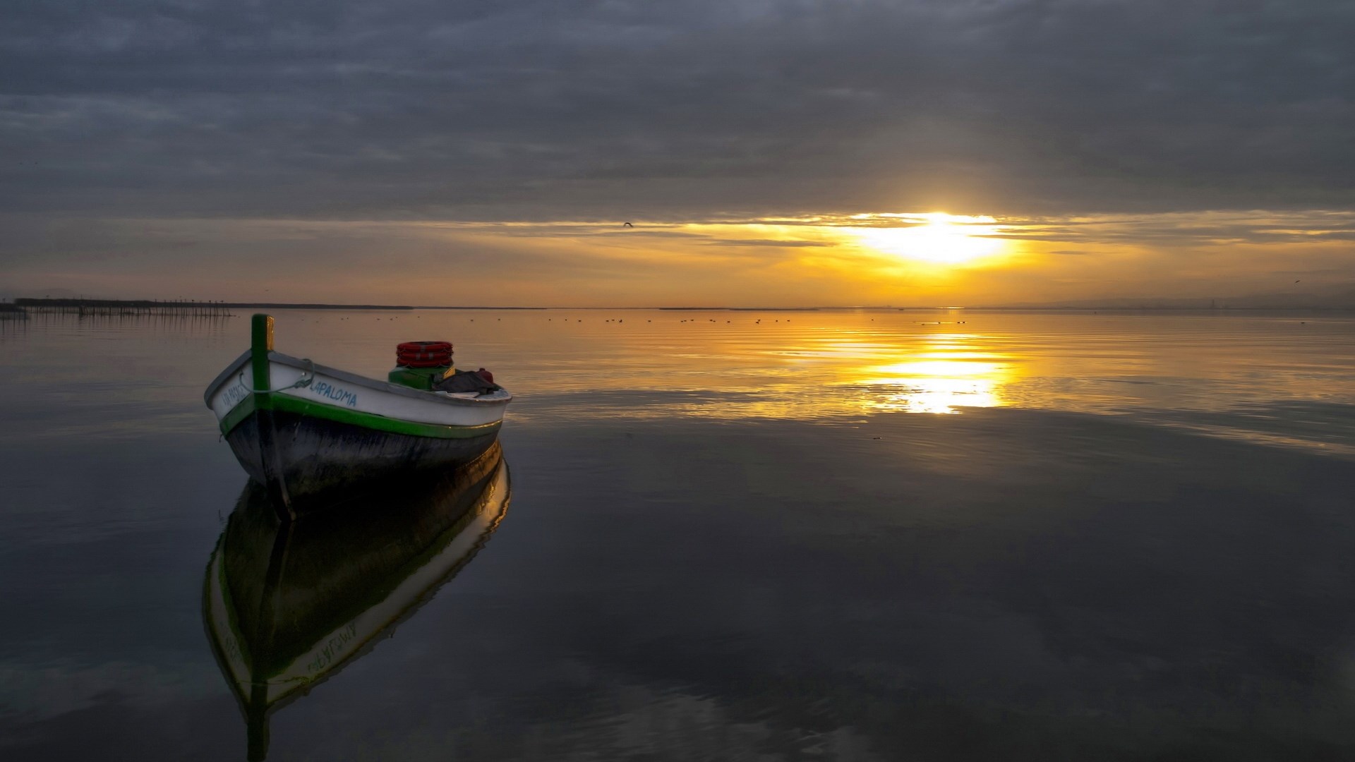 Boat on calm water at sunset HD Wallpaper